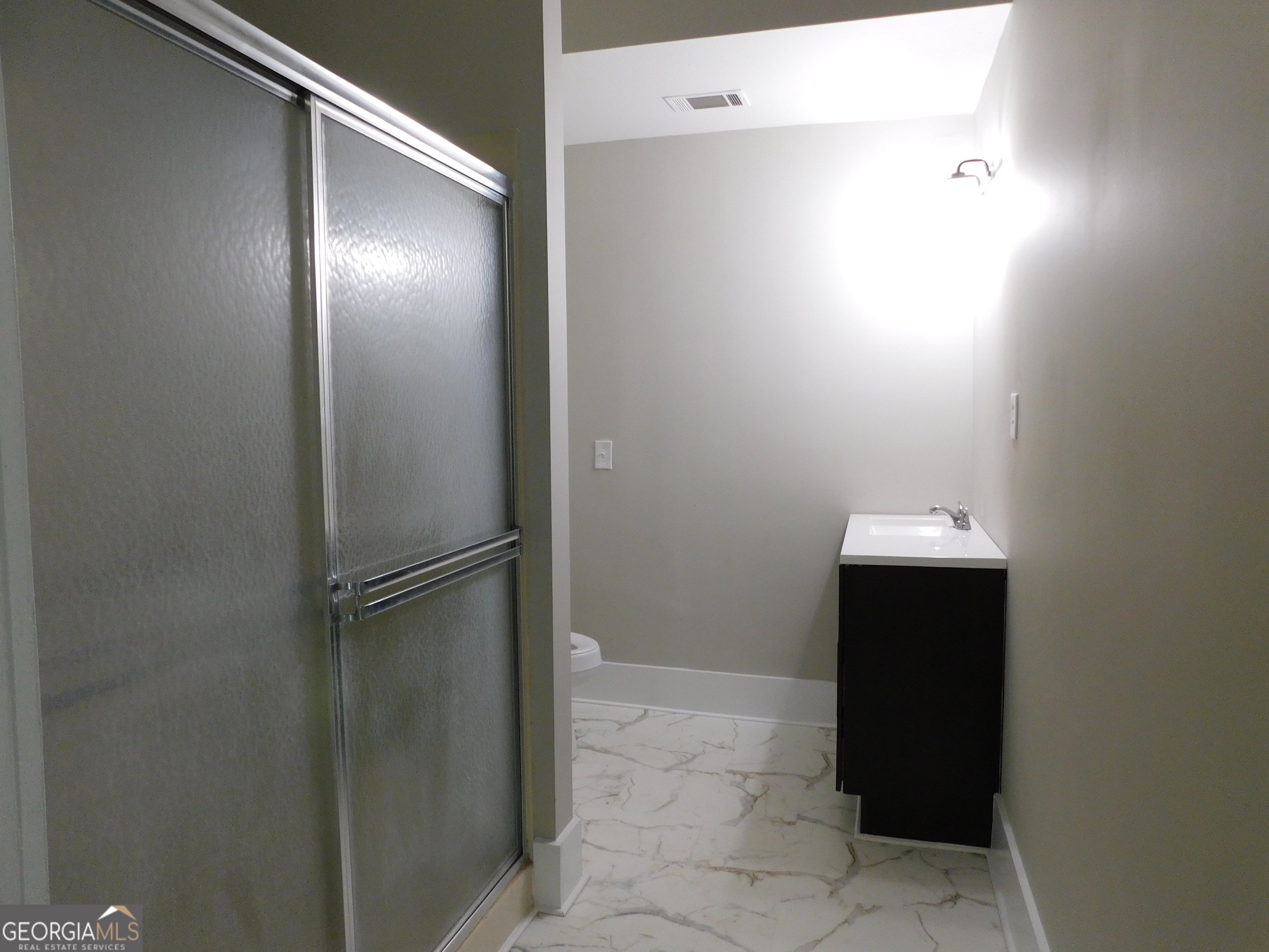 206 East Lane Street Brooklet, GA 30415 - Photo 29 of 33 a bathroom with a sink and a mirror