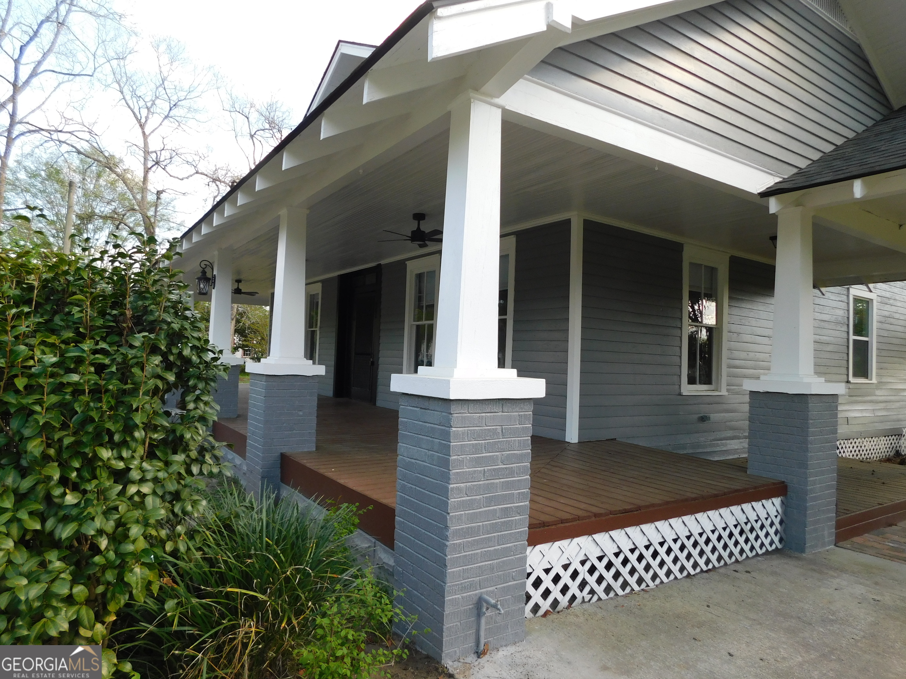 206 East Lane Street Brooklet, GA 30415 - Photo 30 of 33 front view of a house with a bench