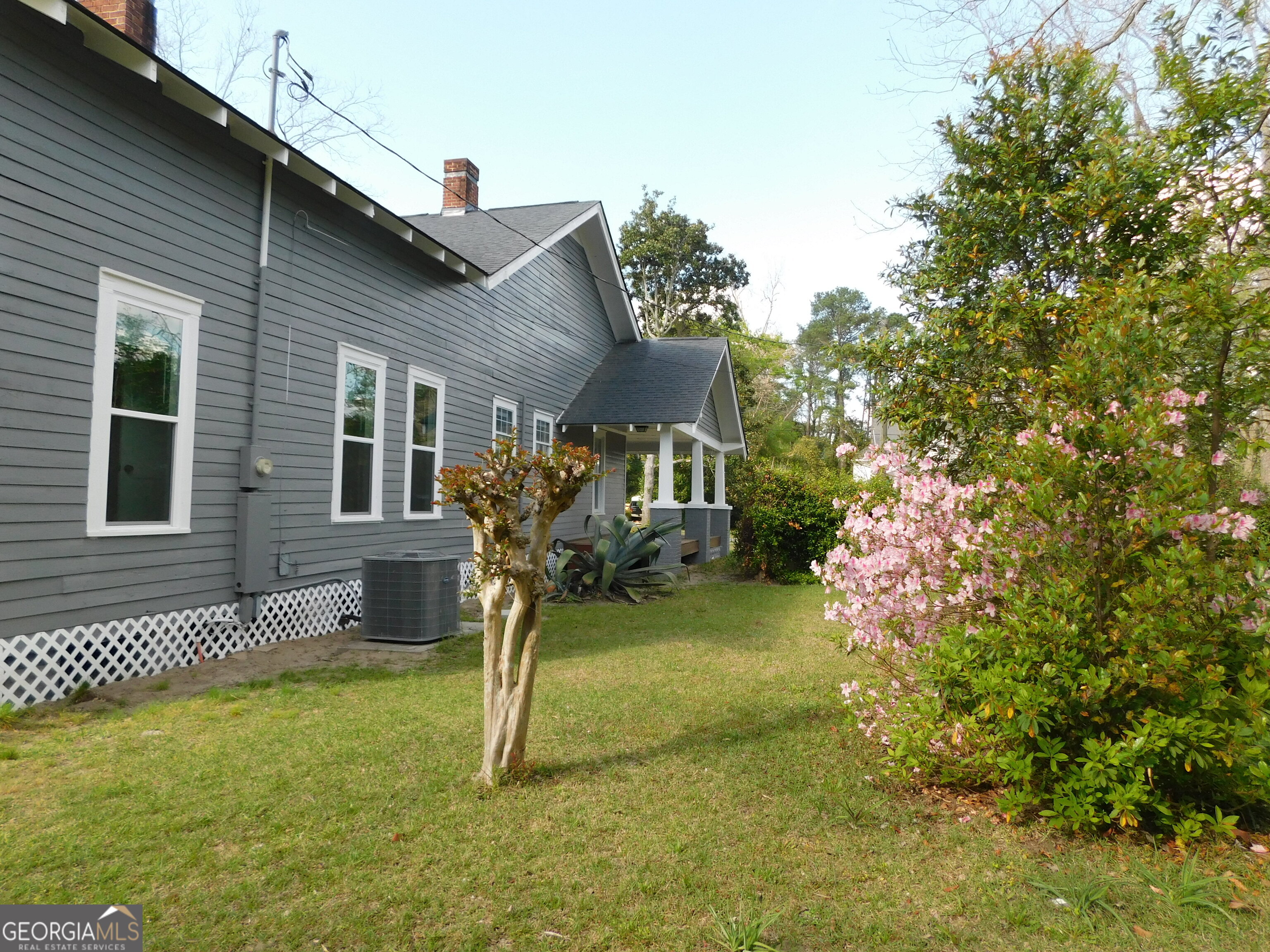 206 East Lane Street Brooklet, GA 30415 - Photo 33 of 33 a house view with a garden space