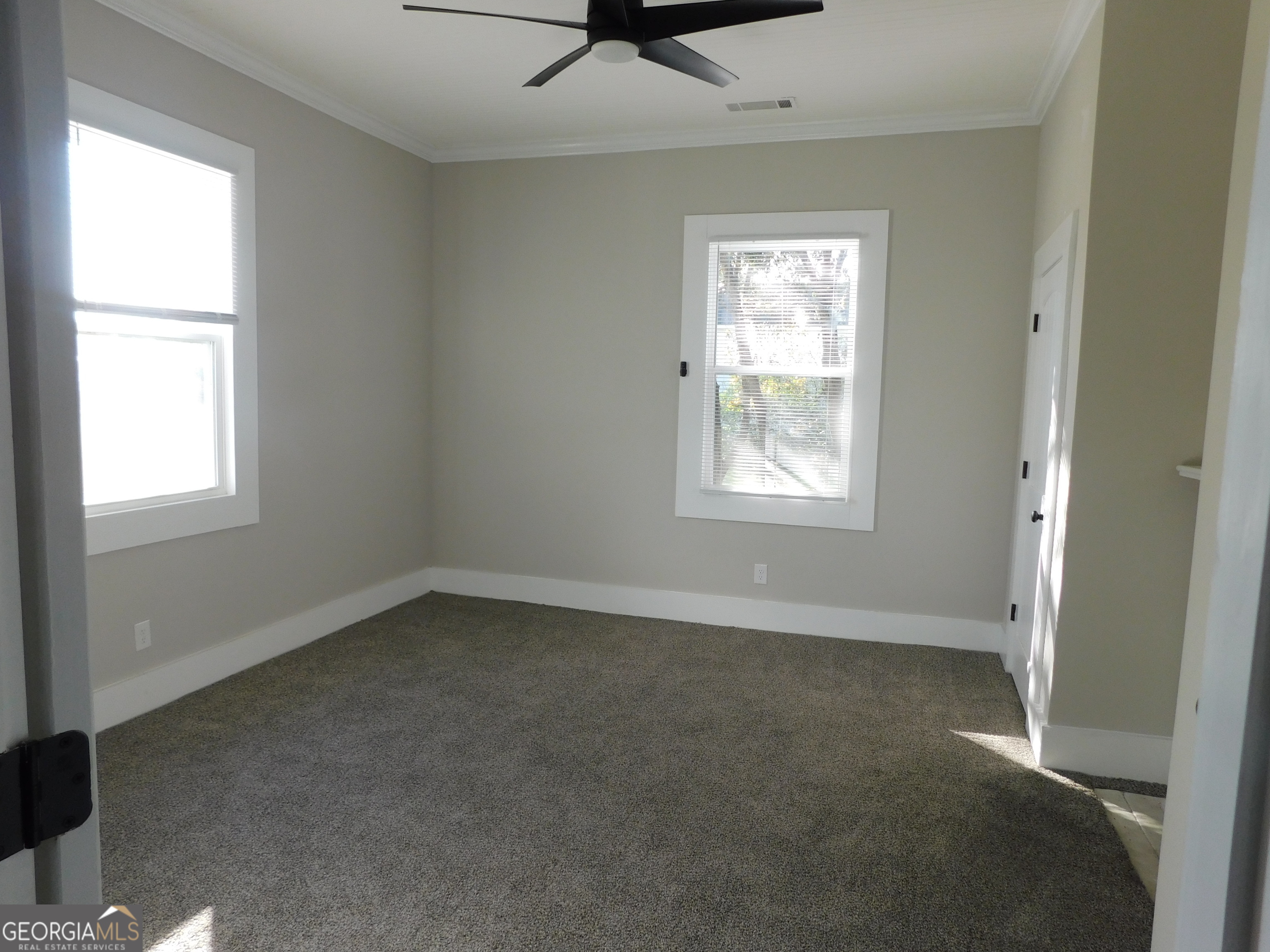 206 East Lane Street Brooklet, GA 30415 - Photo 4 of 33 an empty room with a window