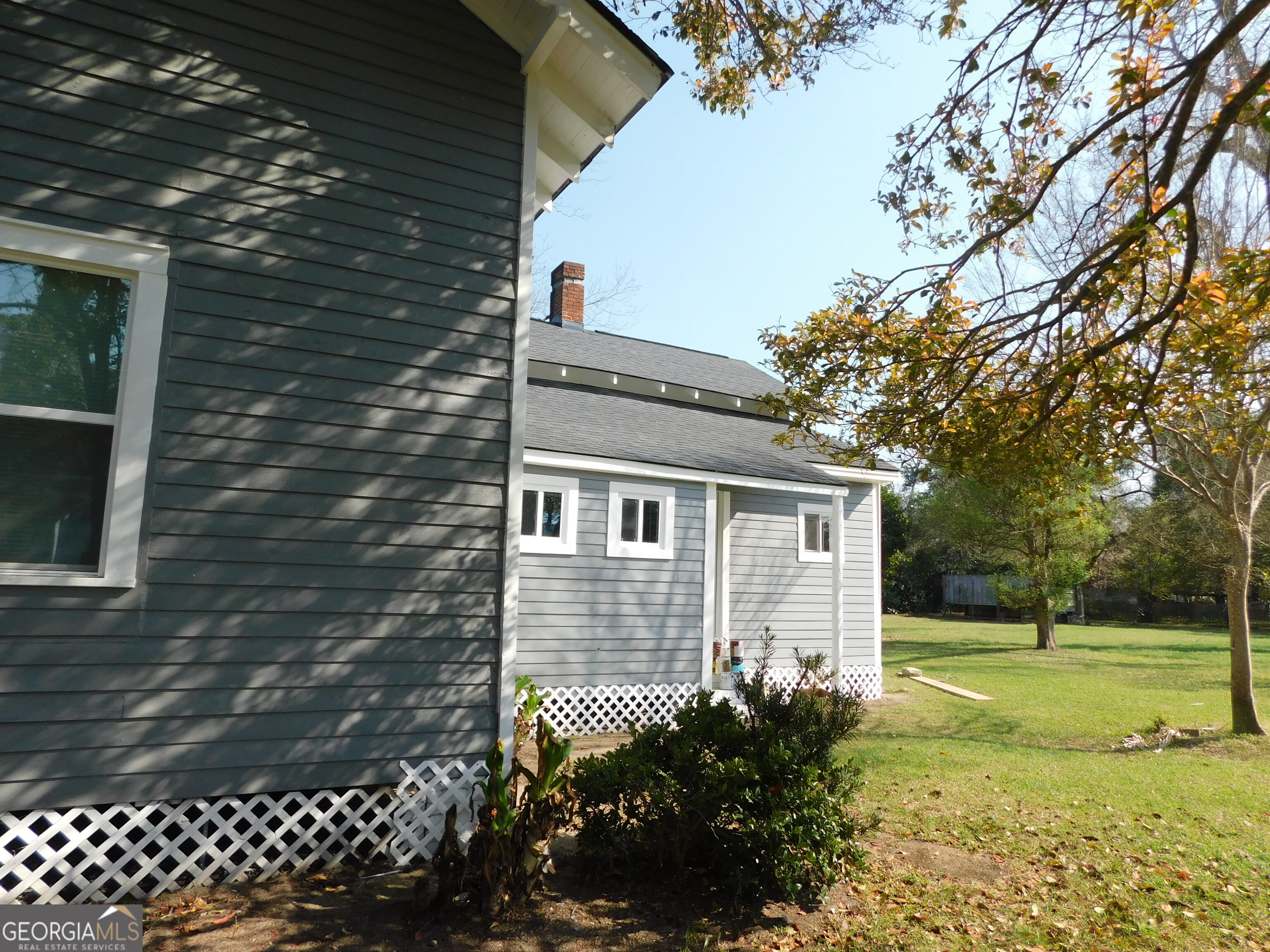 206 East Lane Street Brooklet, GA 30415 - Photo 5 of 33 a front view of a house with garden