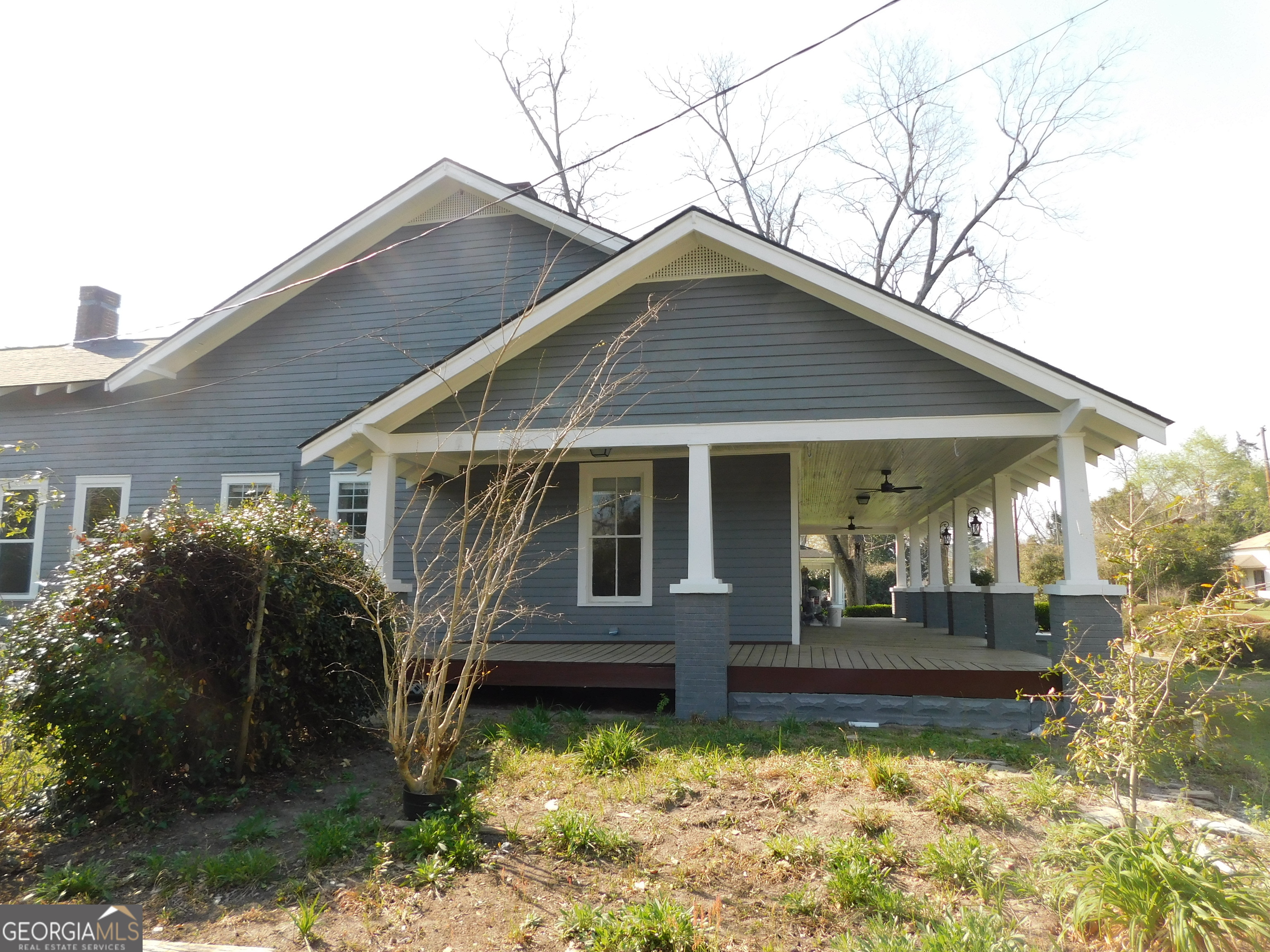 206 East Lane Street Brooklet, GA 30415 - Photo 10 of 33 a front view of a house with garden