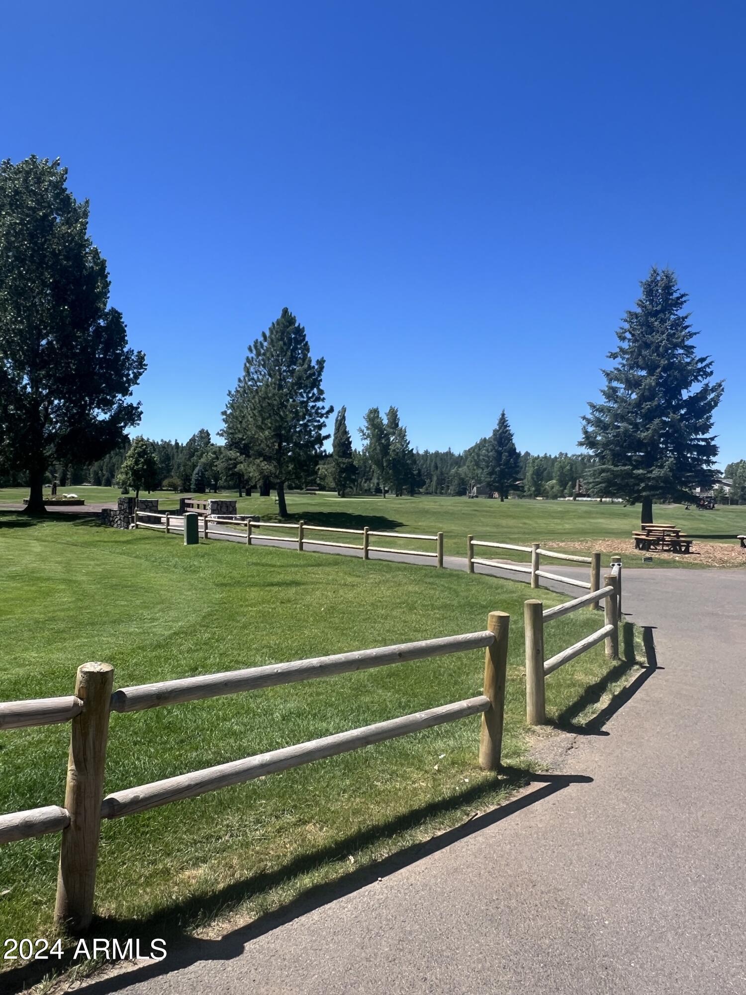17980 Walapai Road, Unit 19A Munds Park, AZ 86017 - Photo 22 of 32 a view of a park with large trees