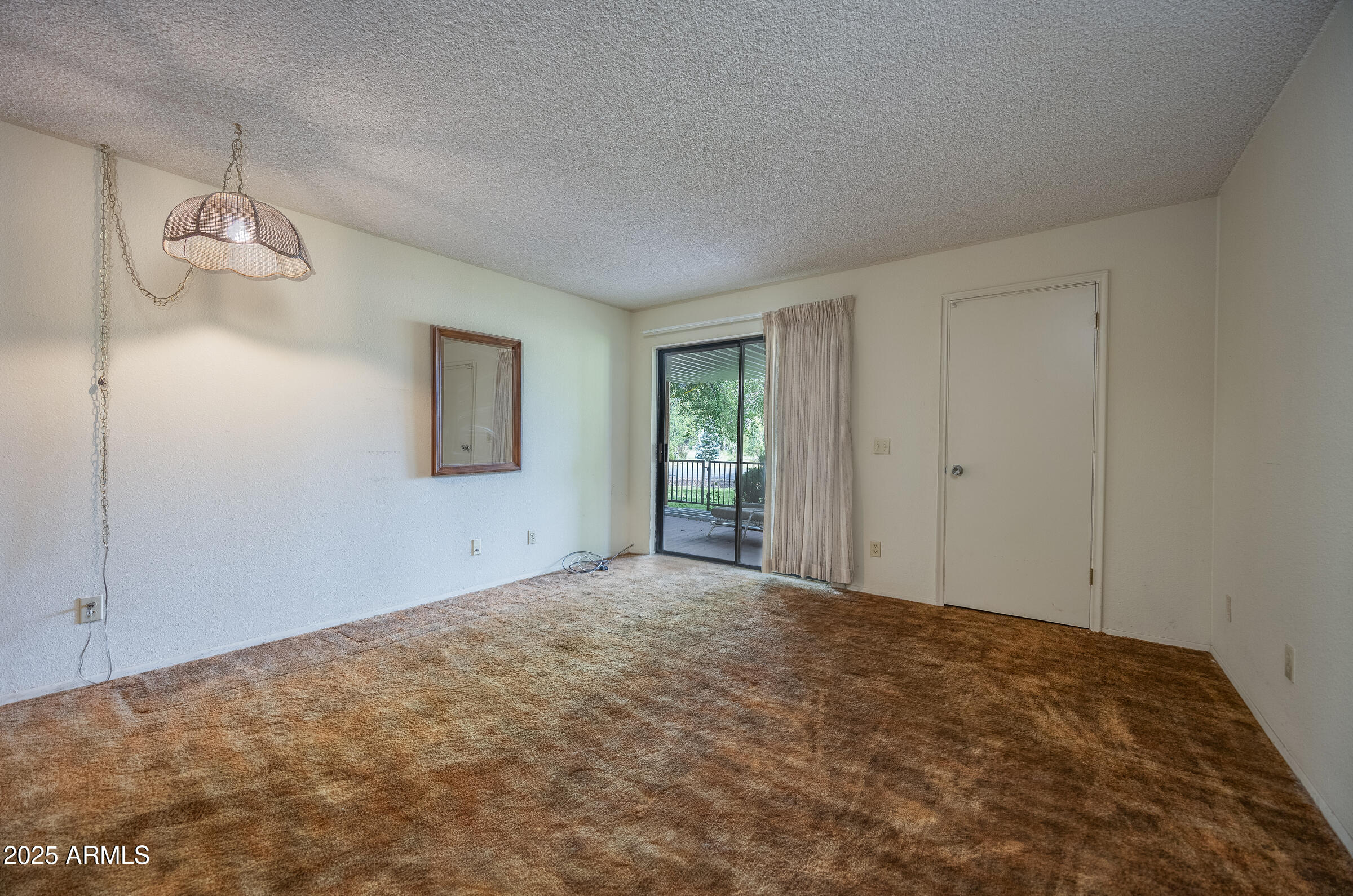 17980 Walapai Road, Unit 19A Munds Park, AZ 86017 - Photo 24 of 32 a view of a big room with closet and windows