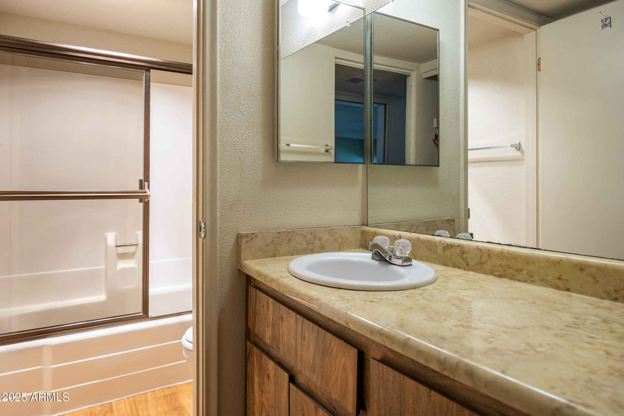 17980 Walapai Road, Unit 19A Munds Park, AZ 86017 - Photo 27 of 32 a bathroom with a sink and a mirror