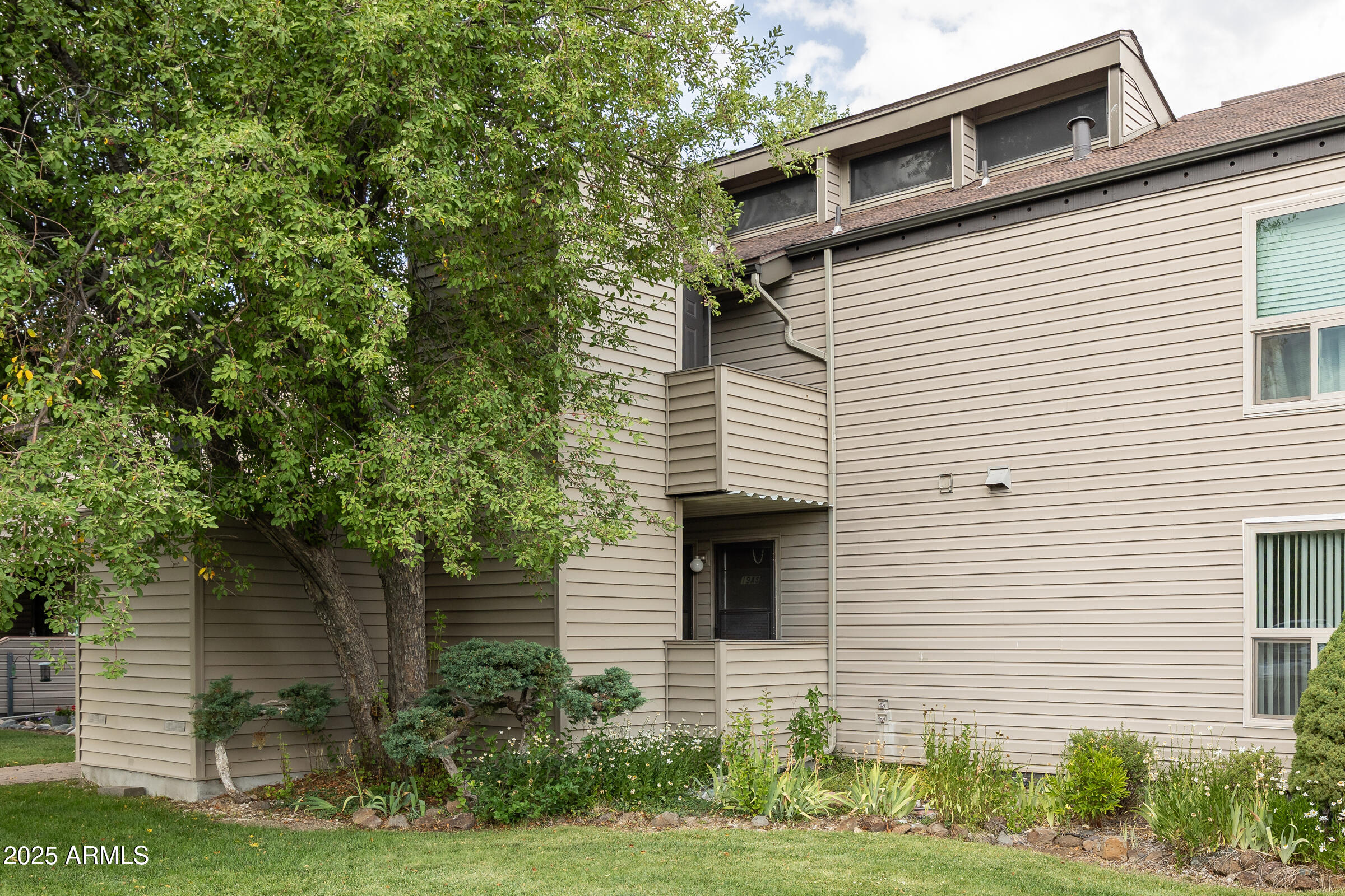17980 Walapai Road, Unit 19A Munds Park, AZ 86017 - Photo 3 of 32 a view of a white house