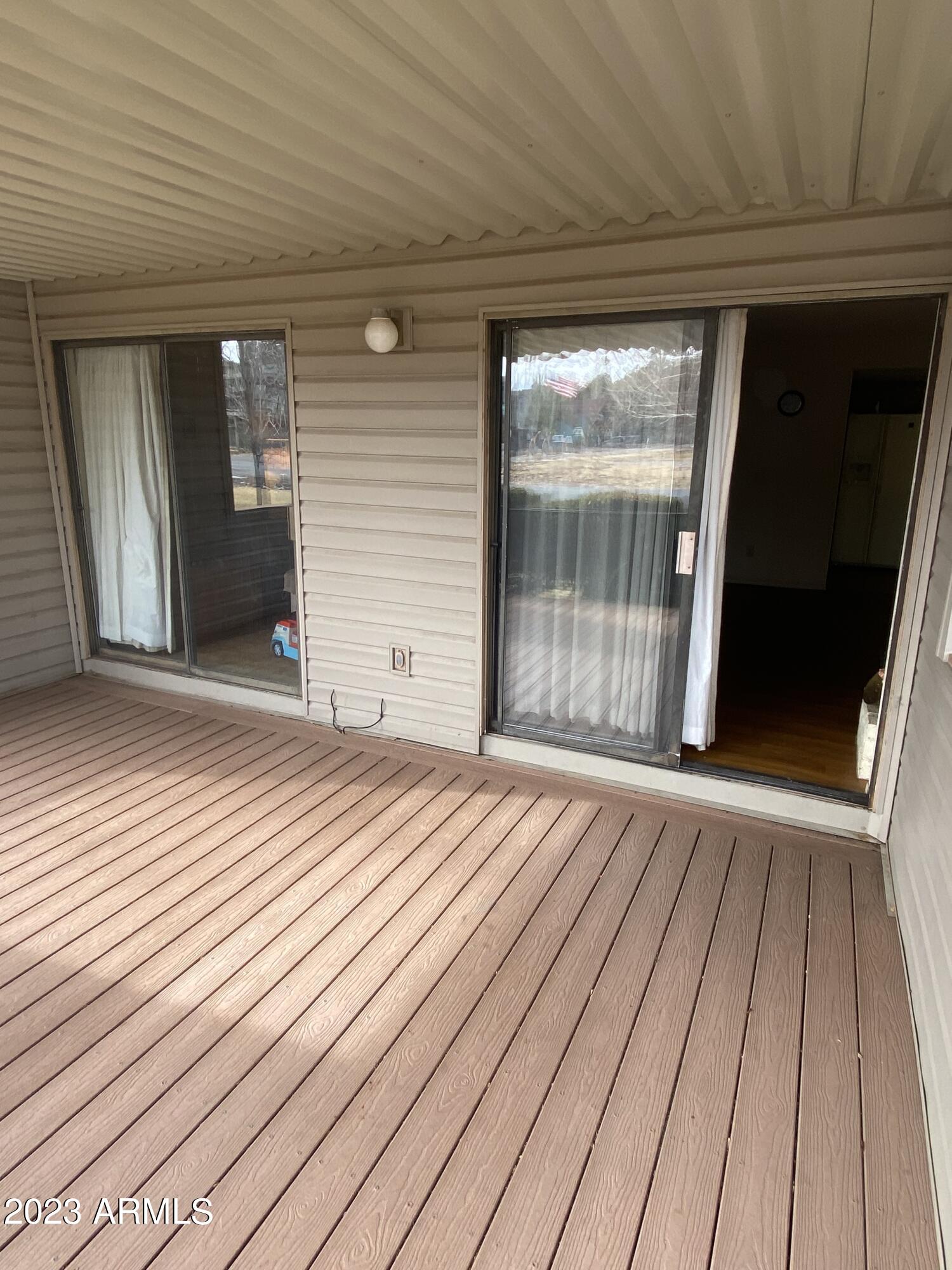 17980 Walapai Road, Unit 19A Munds Park, AZ 86017 - Photo 5 of 32 a view of a room with wooden floor and gate