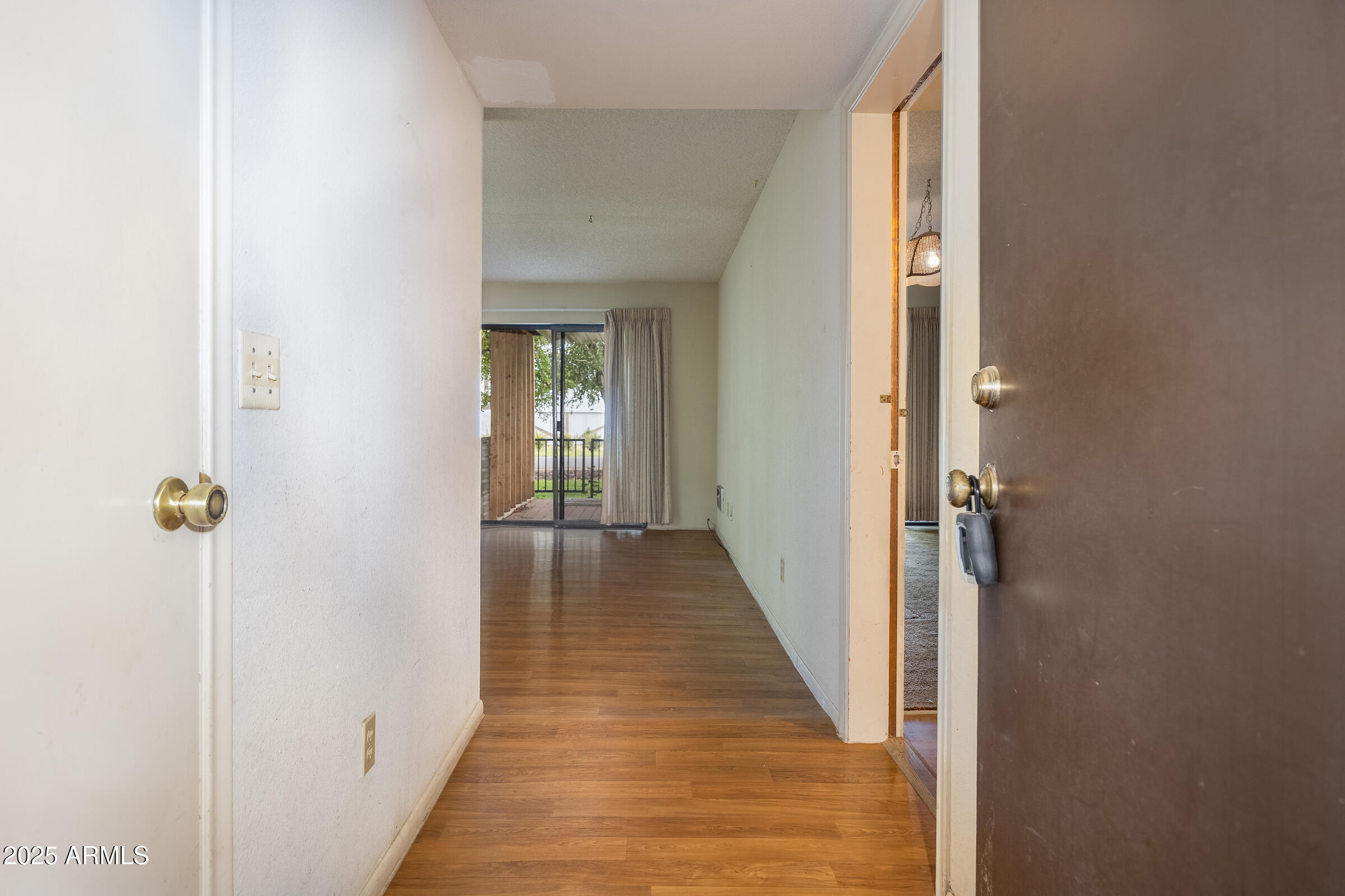 17980 Walapai Road, Unit 19A Munds Park, AZ 86017 - Photo 8 of 32 a view of a hallway with wooden floor