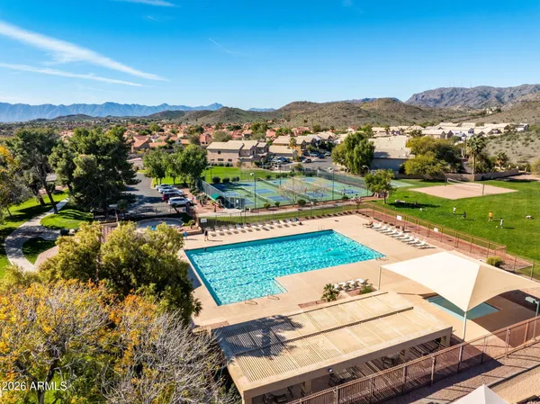 an aerial view of residential houses with outdoor space