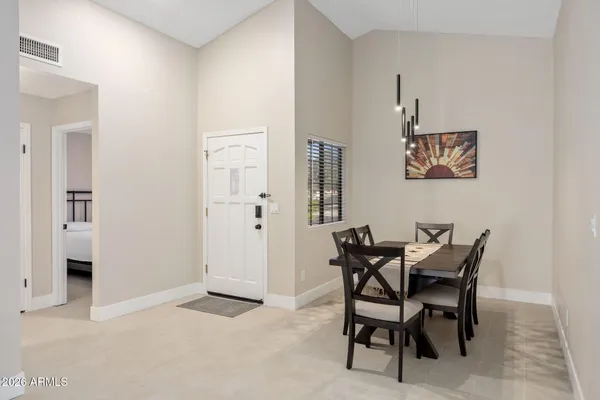 a view of a dining room with furniture
