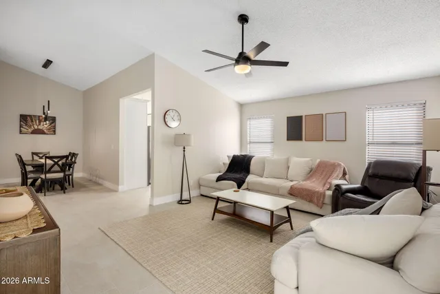 a living room with furniture and a window