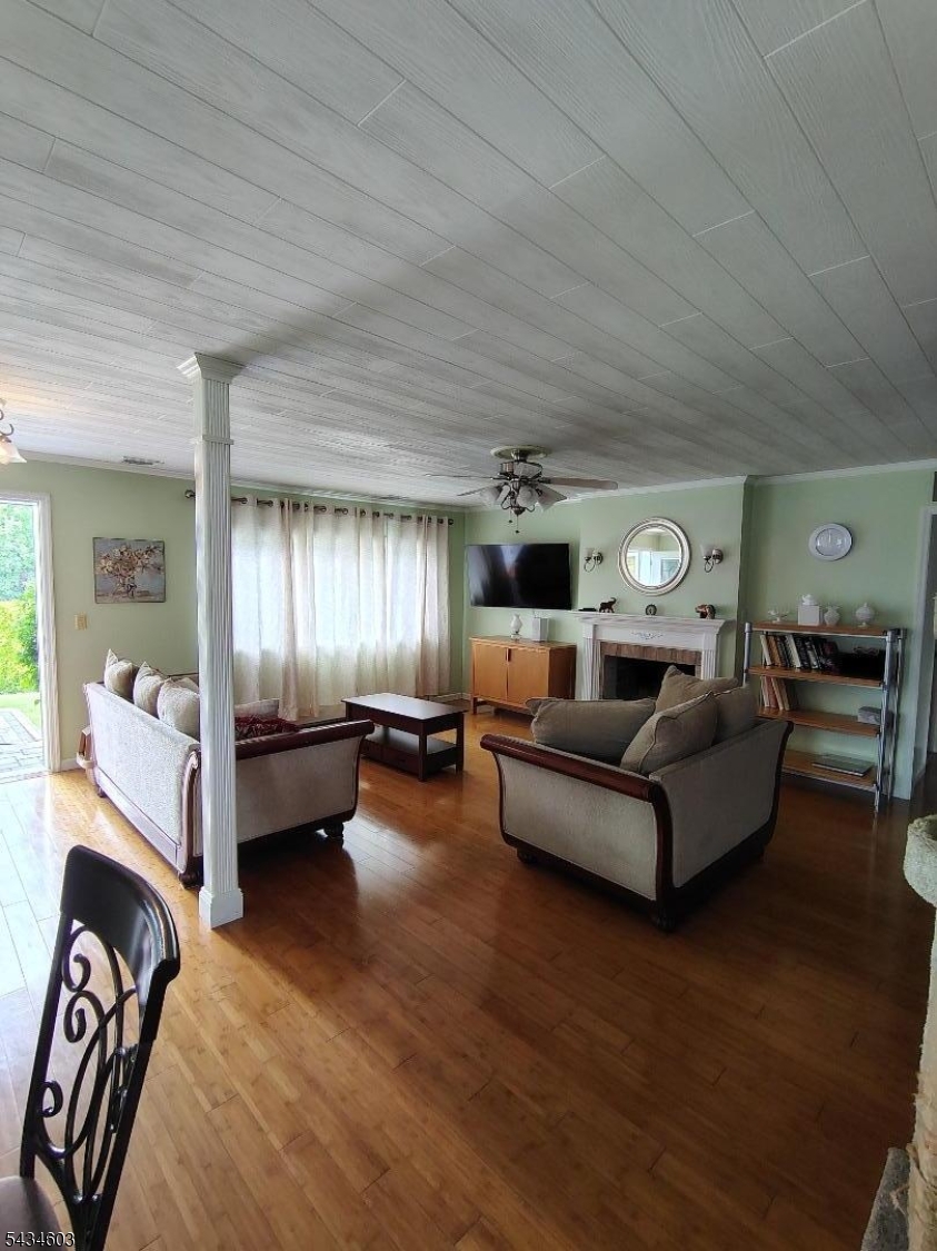442 River Road North Arlington, NJ 07031 - Photo 4 of 26 a living room with furniture and wooden floor