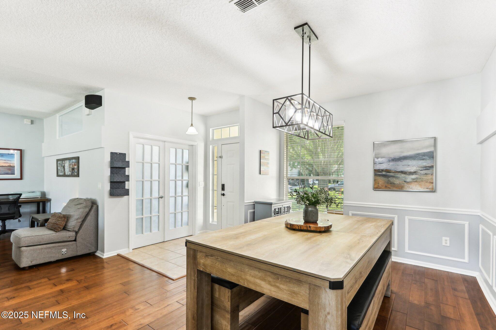 2124 Pond Spring Way Fleming Island, FL 32003 - Photo 11 of 56 a dining room with furniture and window