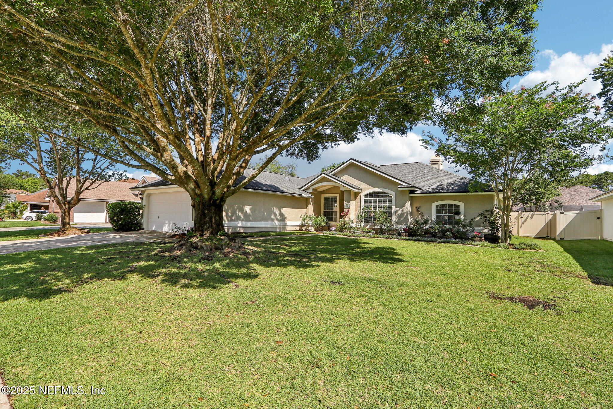 2124 Pond Spring Way Fleming Island, FL 32003 - Photo 2 of 56 a front view of house with yard and green space