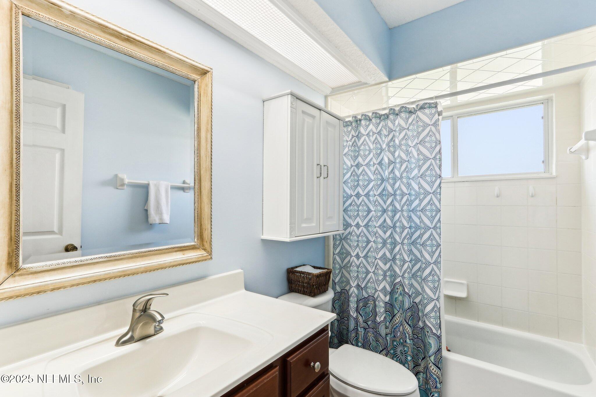 2124 Pond Spring Way Fleming Island, FL 32003 - Photo 25 of 56 a bathroom with a sink toilet and shower