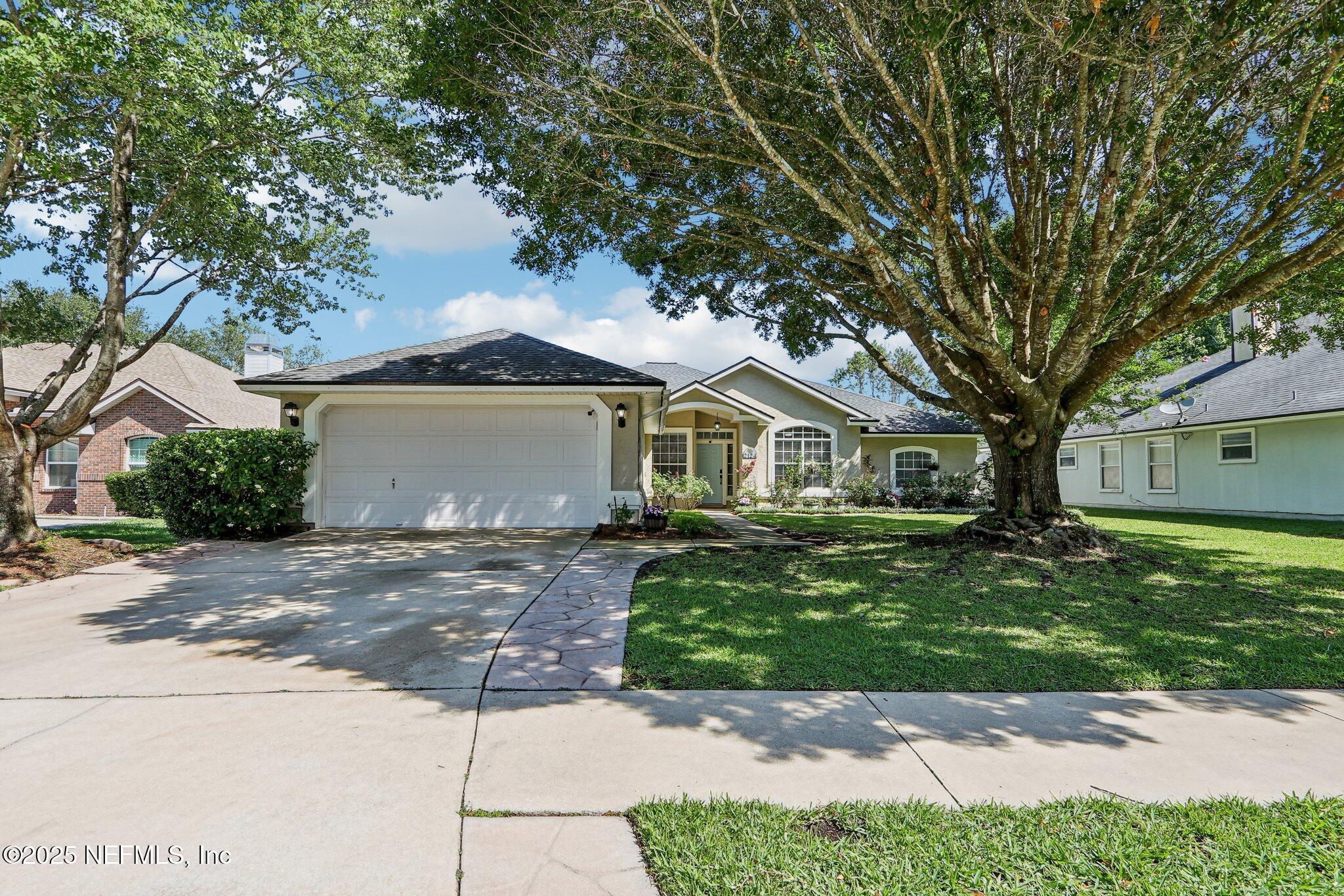 2124 Pond Spring Way Fleming Island, FL 32003 - Photo 3 of 56 a front view of house with yard