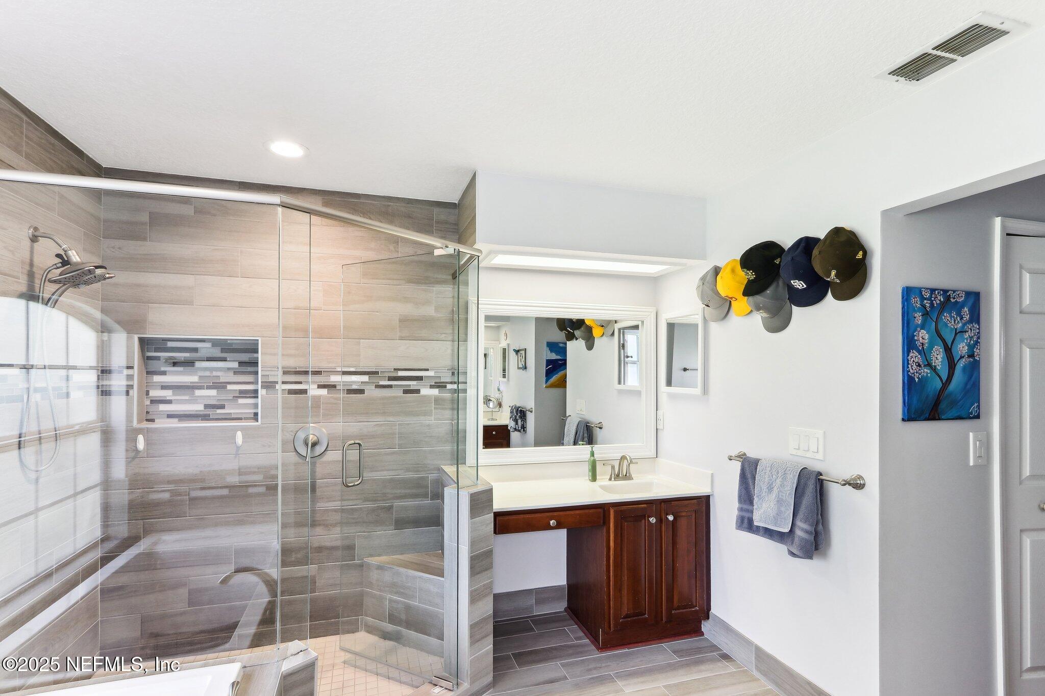 2124 Pond Spring Way Fleming Island, FL 32003 - Photo 34 of 56 a bathroom with a sink and a shower