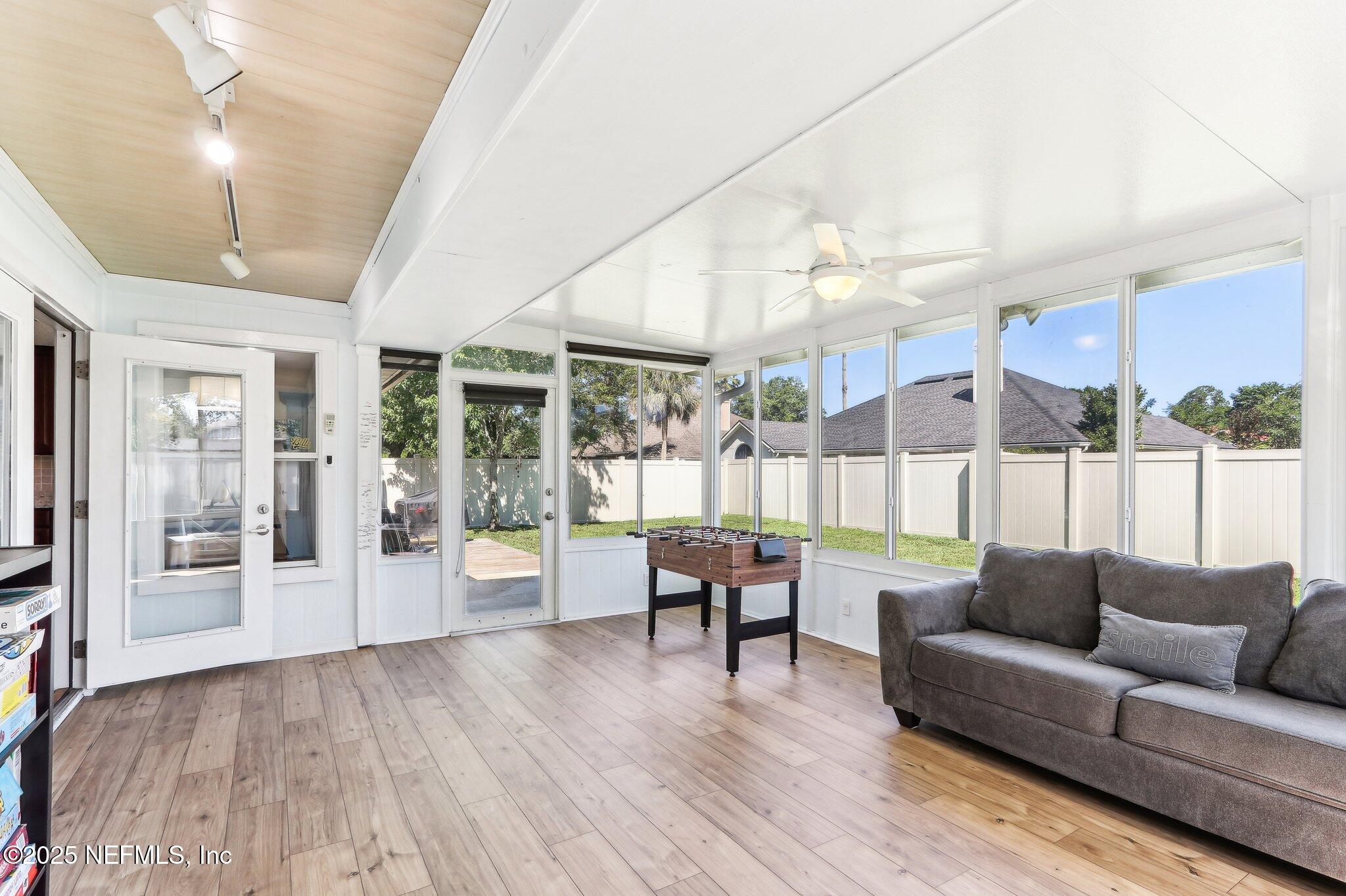 2124 Pond Spring Way Fleming Island, FL 32003 - Photo 37 of 56 a living room with furniture and wooden floor