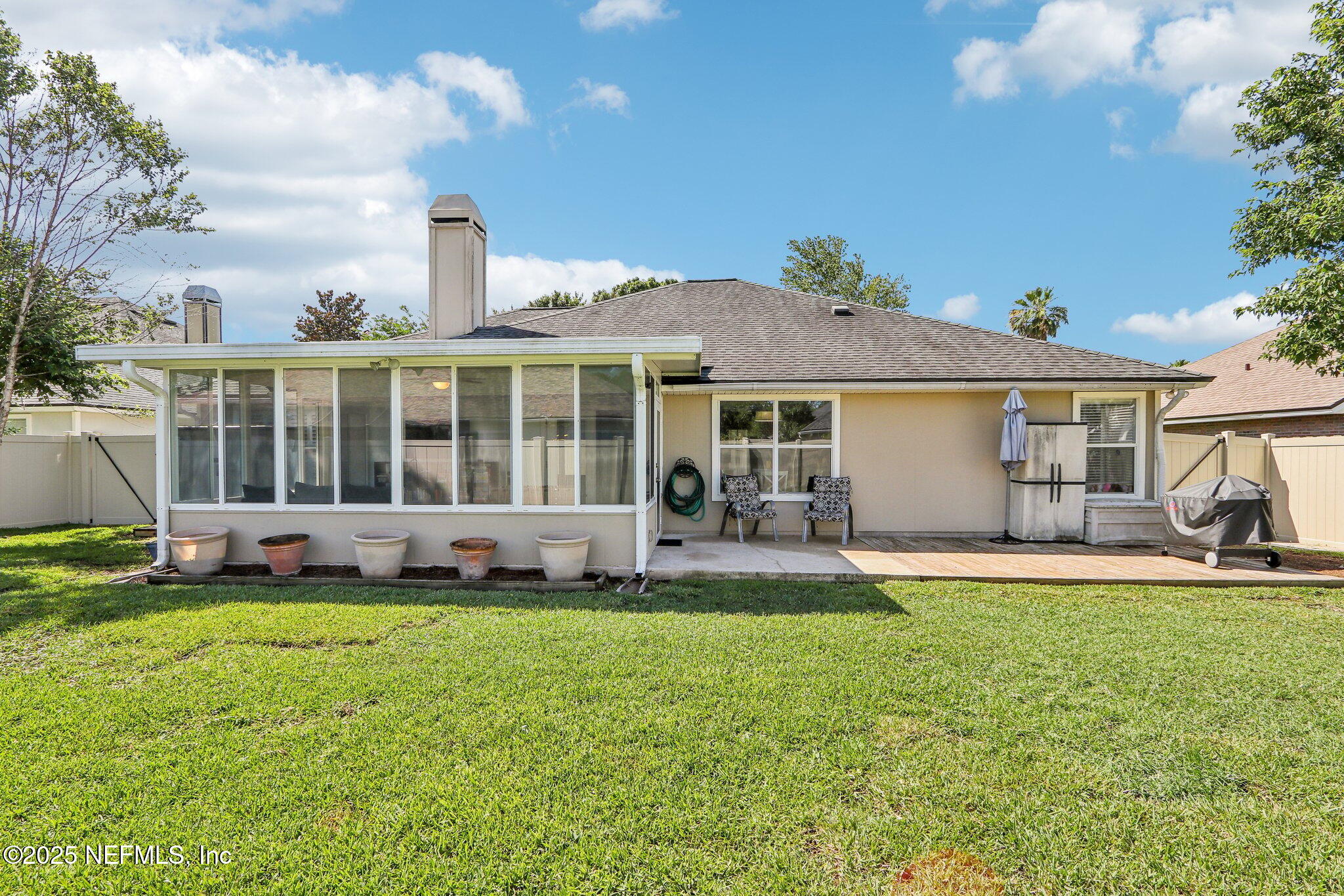 2124 Pond Spring Way Fleming Island, FL 32003 - Photo 39 of 56 a view of a house with a yard and sitting area