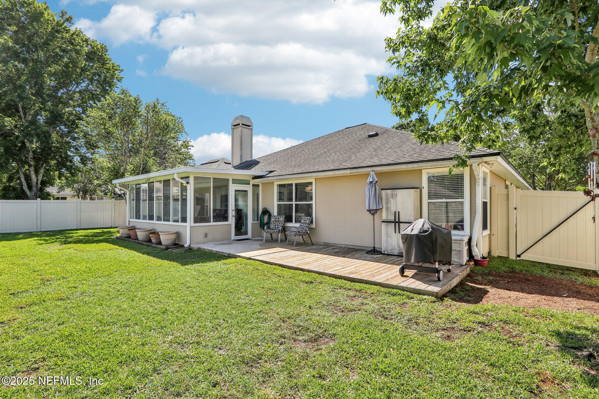 2124 Pond Spring Way Fleming Island, FL 32003 - Photo 40 of 56 a house view with a sitting space and garden
