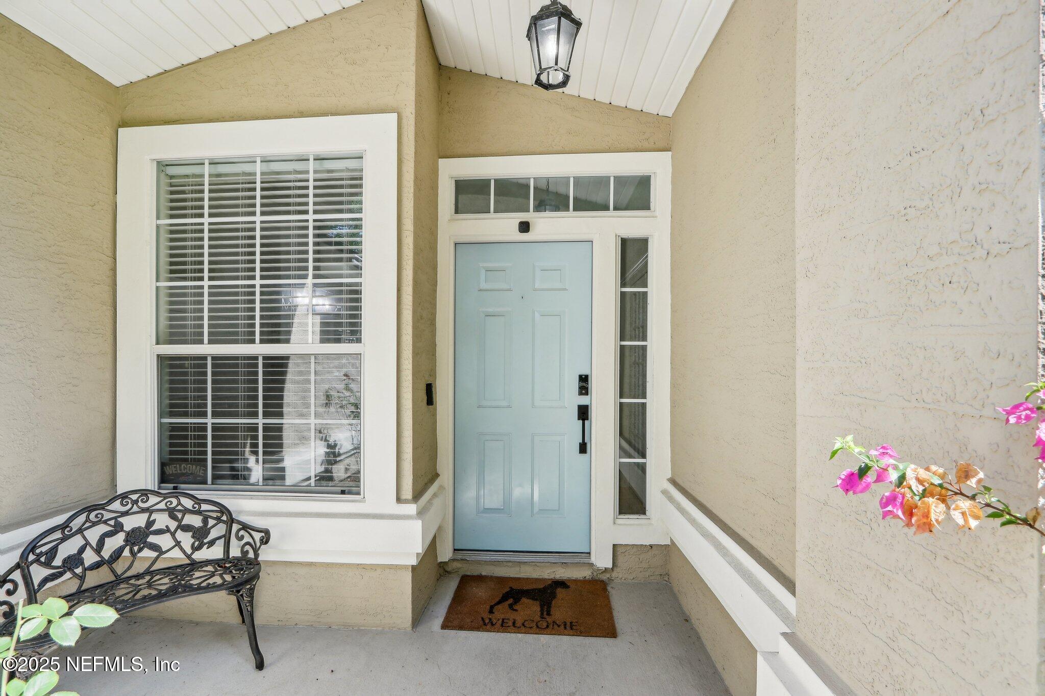 2124 Pond Spring Way Fleming Island, FL 32003 - Photo 5 of 56 a living room with a bed furniture and a window