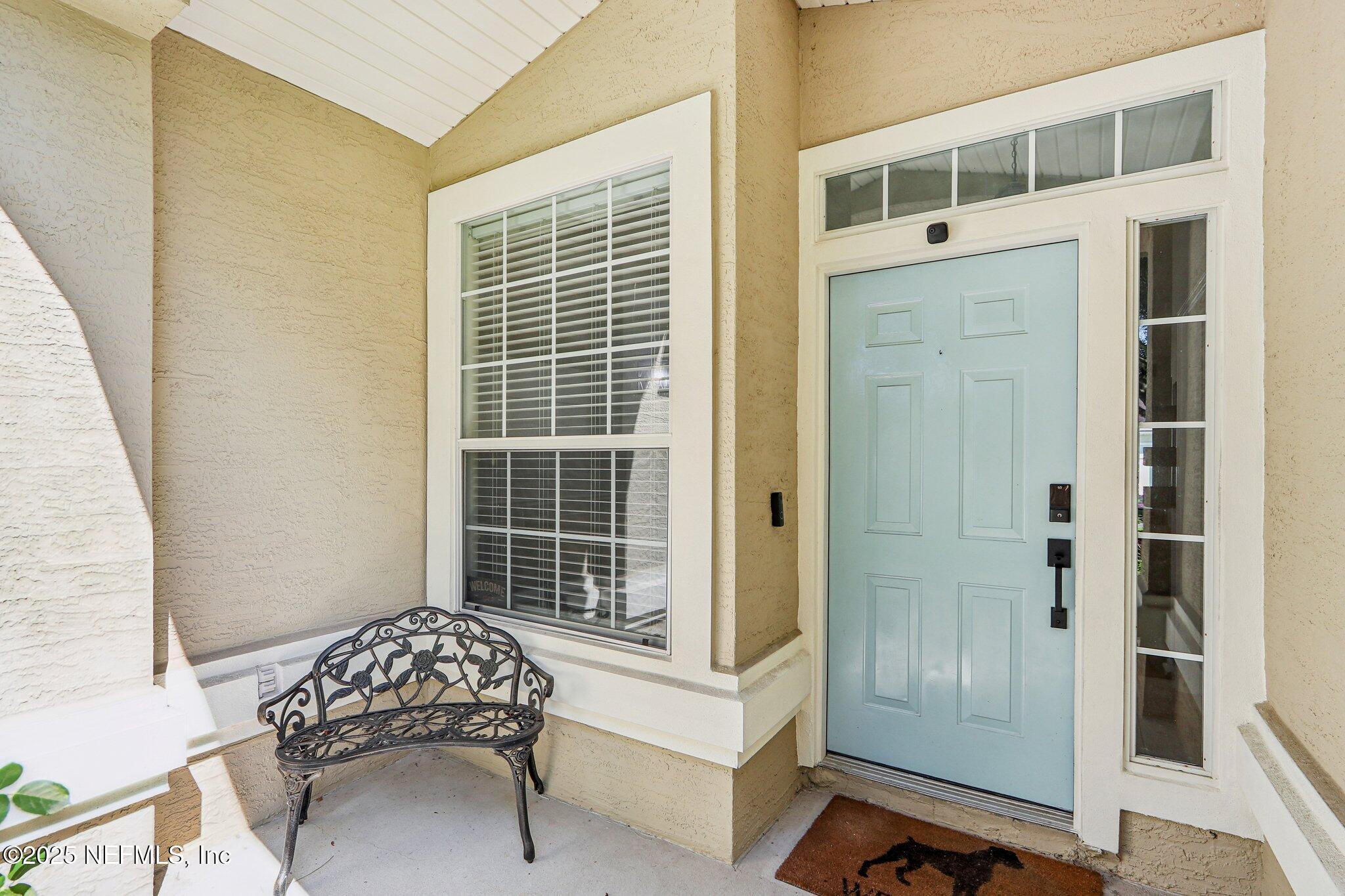 2124 Pond Spring Way Fleming Island, FL 32003 - Photo 6 of 56 a living room with a bed and a window