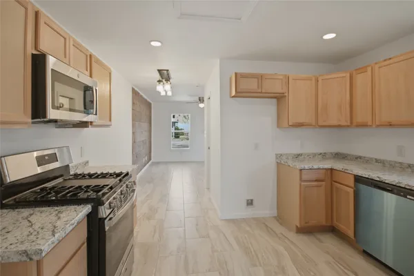 a kitchen with a stove and a sink