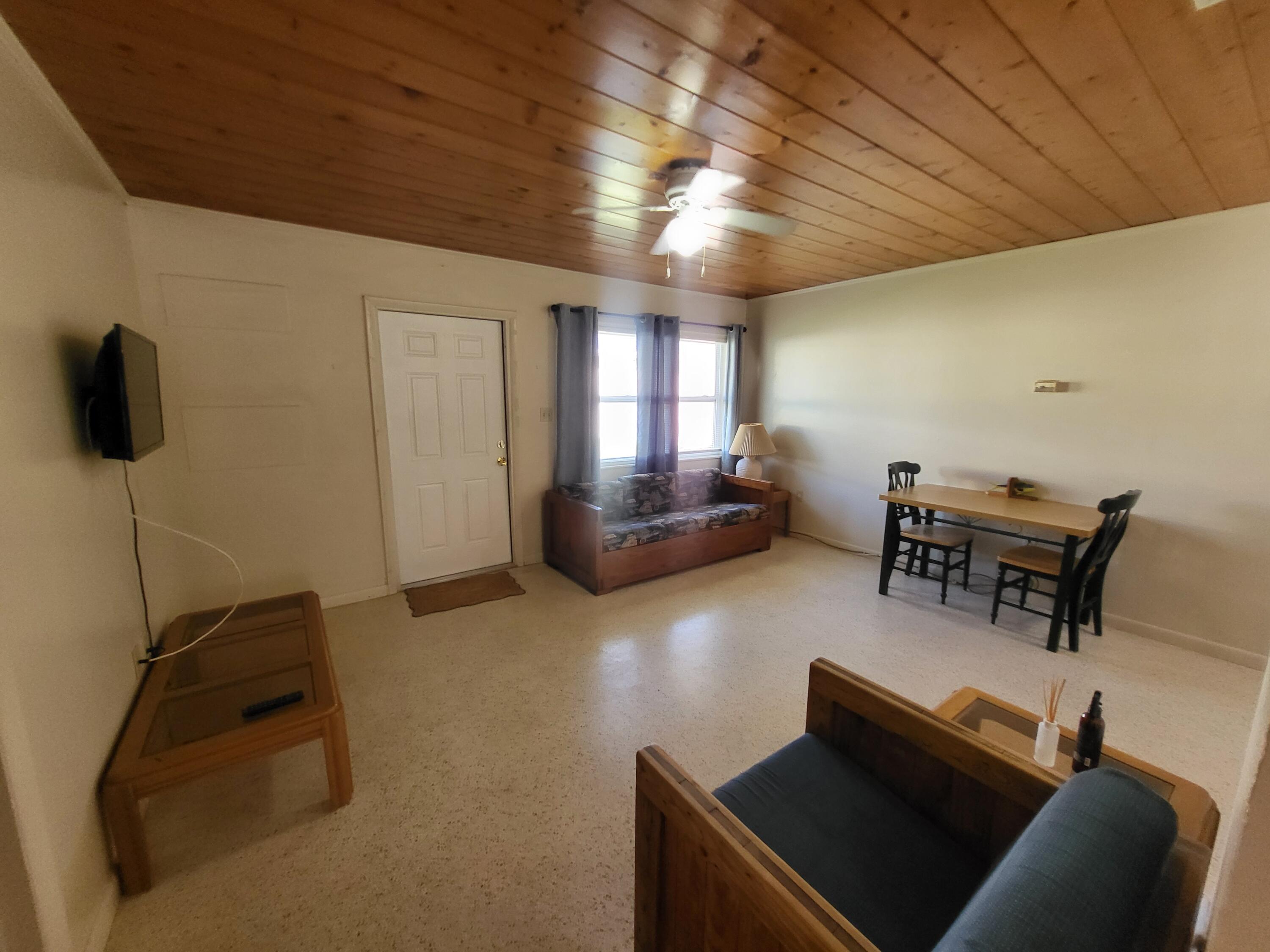 1169 Seaway Drive, Unit A Fort Pierce, FL 34949 - Photo 6 of 13 a living room with furniture