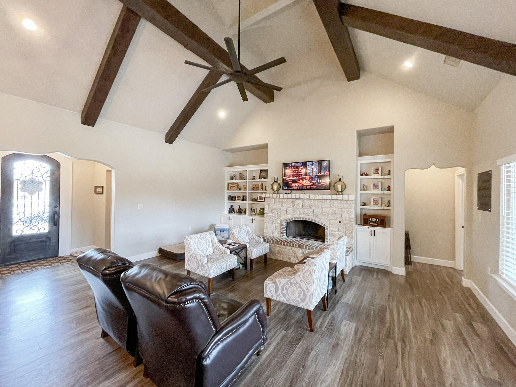 3808 138th Street Lubbock, TX 79423 - Photo 4 of 17 a living room with furniture and a fireplace