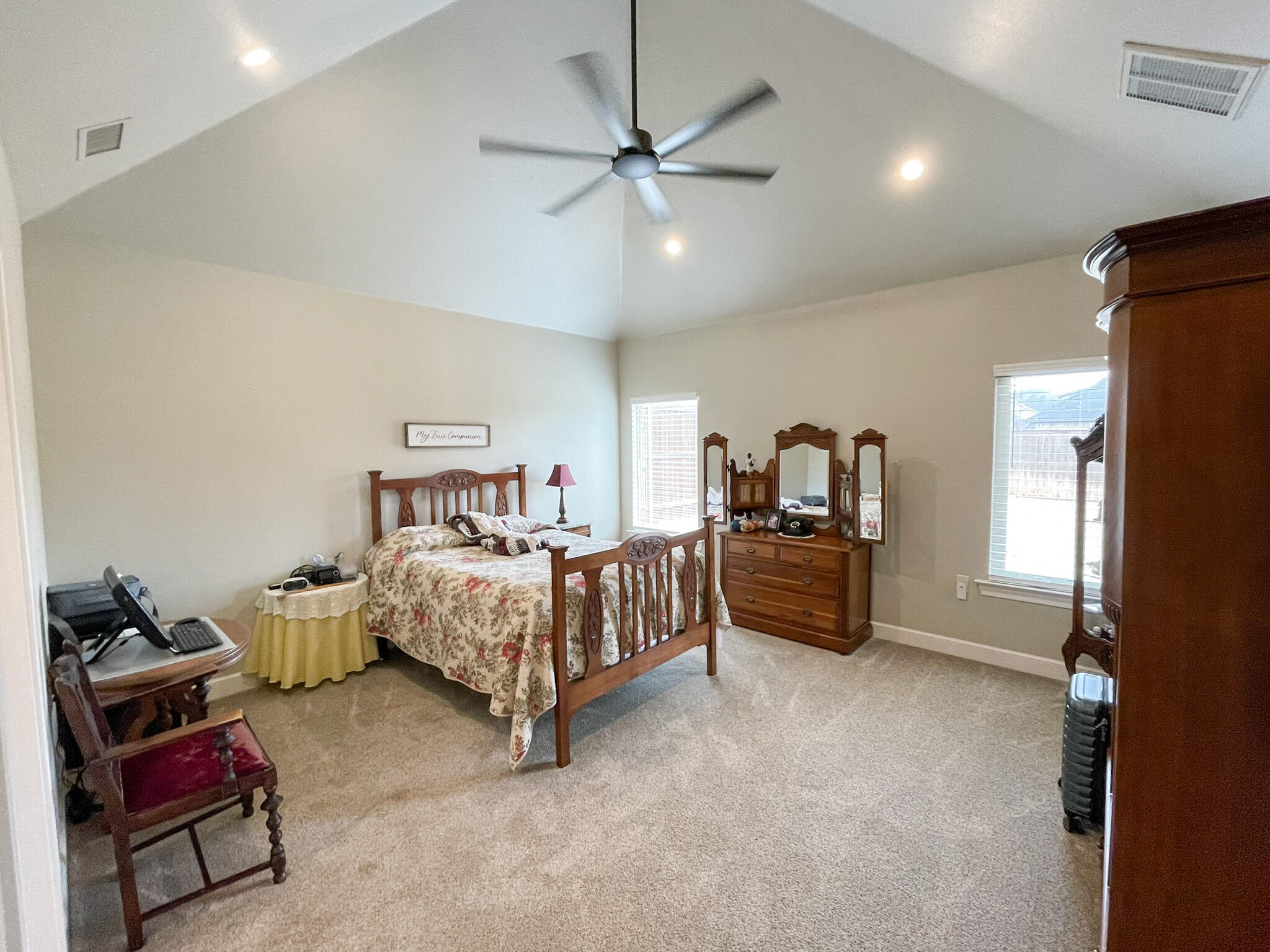 3808 138th Street Lubbock, TX 79423 - Photo 10 of 17 a bedroom with furniture and a window
