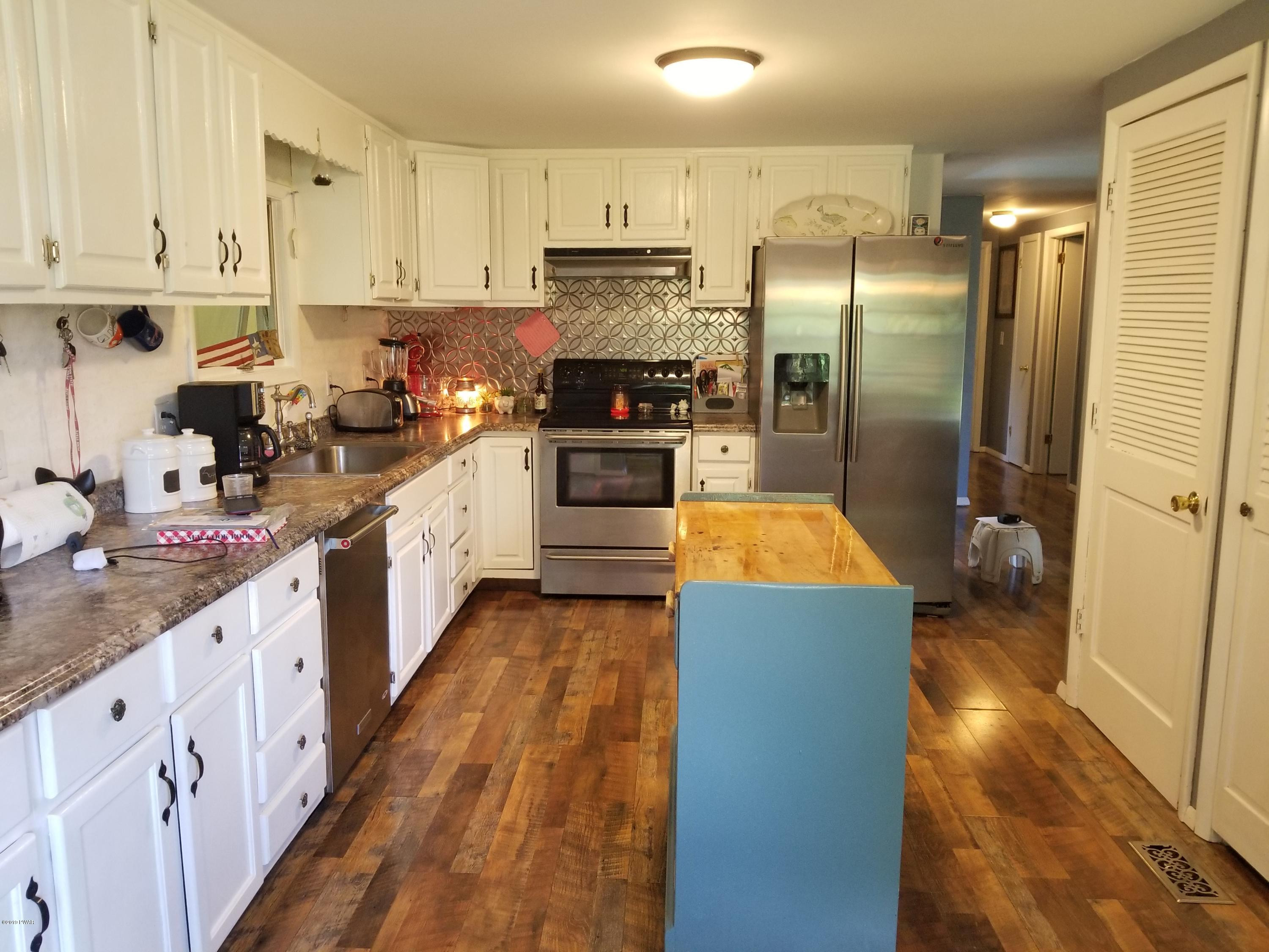 144 Mid Valley Road Lake Ariel, PA 18436 - Photo 15 of 55 a kitchen with stainless steel appliances granite countertop a refrigerator a stove and a sink