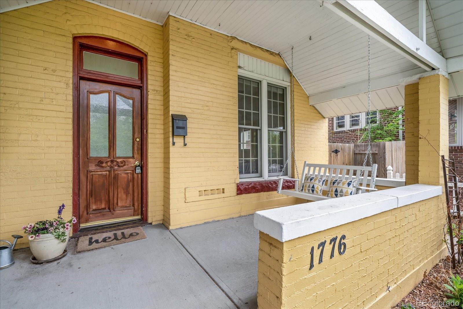 1776 South Logan Street Denver, CO 80210 - Photo 2 of 21 a view of an entryway with a table and chairs