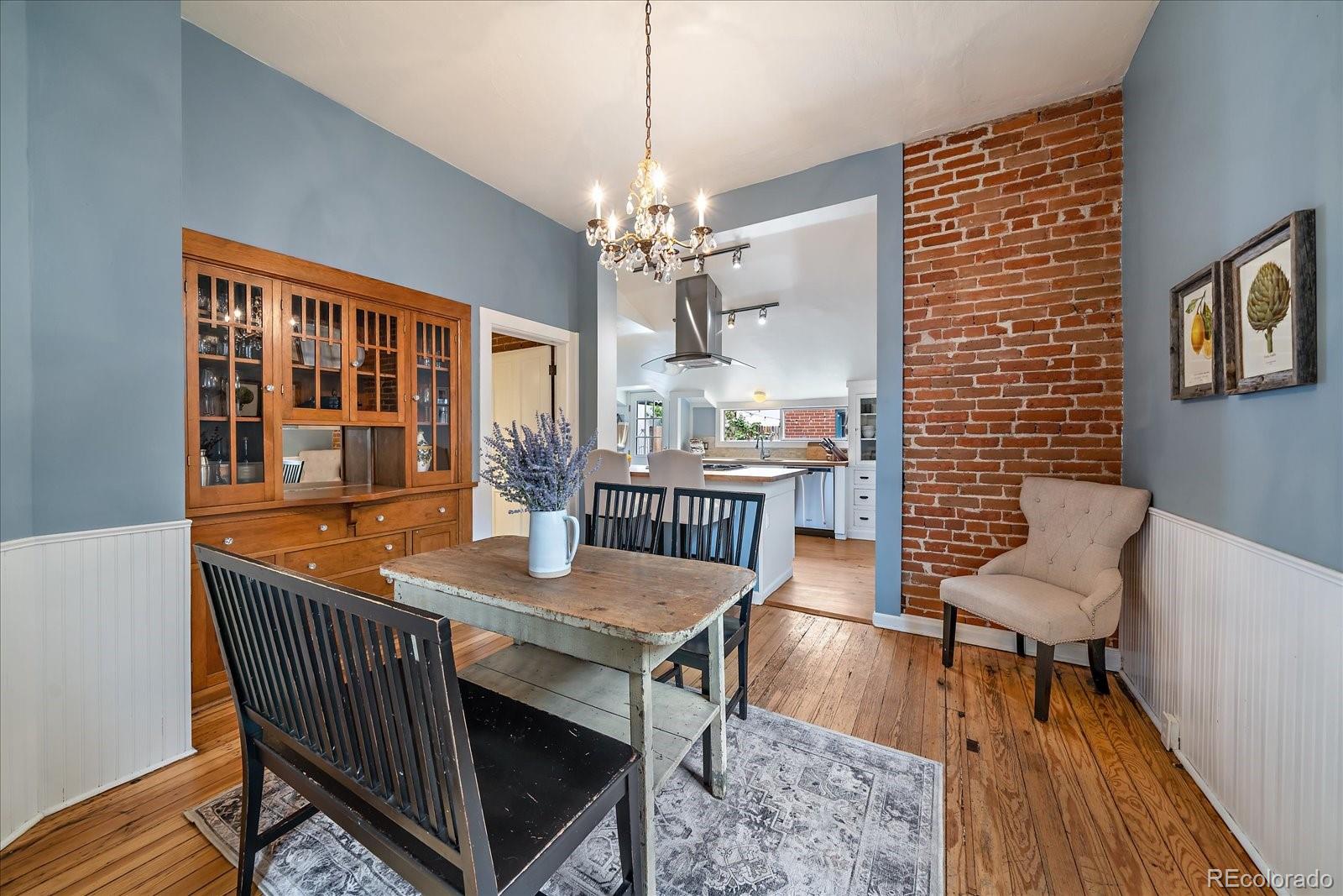 1776 South Logan Street Denver, CO 80210 - Photo 8 of 21 a view of a dining room with furniture window and wooden floor