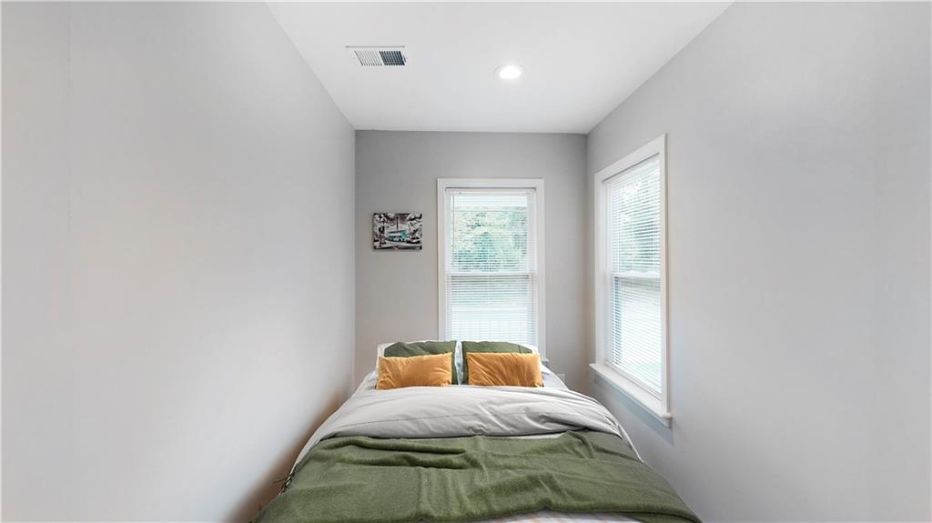 1333 Campbellton Road Southwest Atlanta, GA 30310 - Photo 16 of 21 a bedroom with a bed and a window
