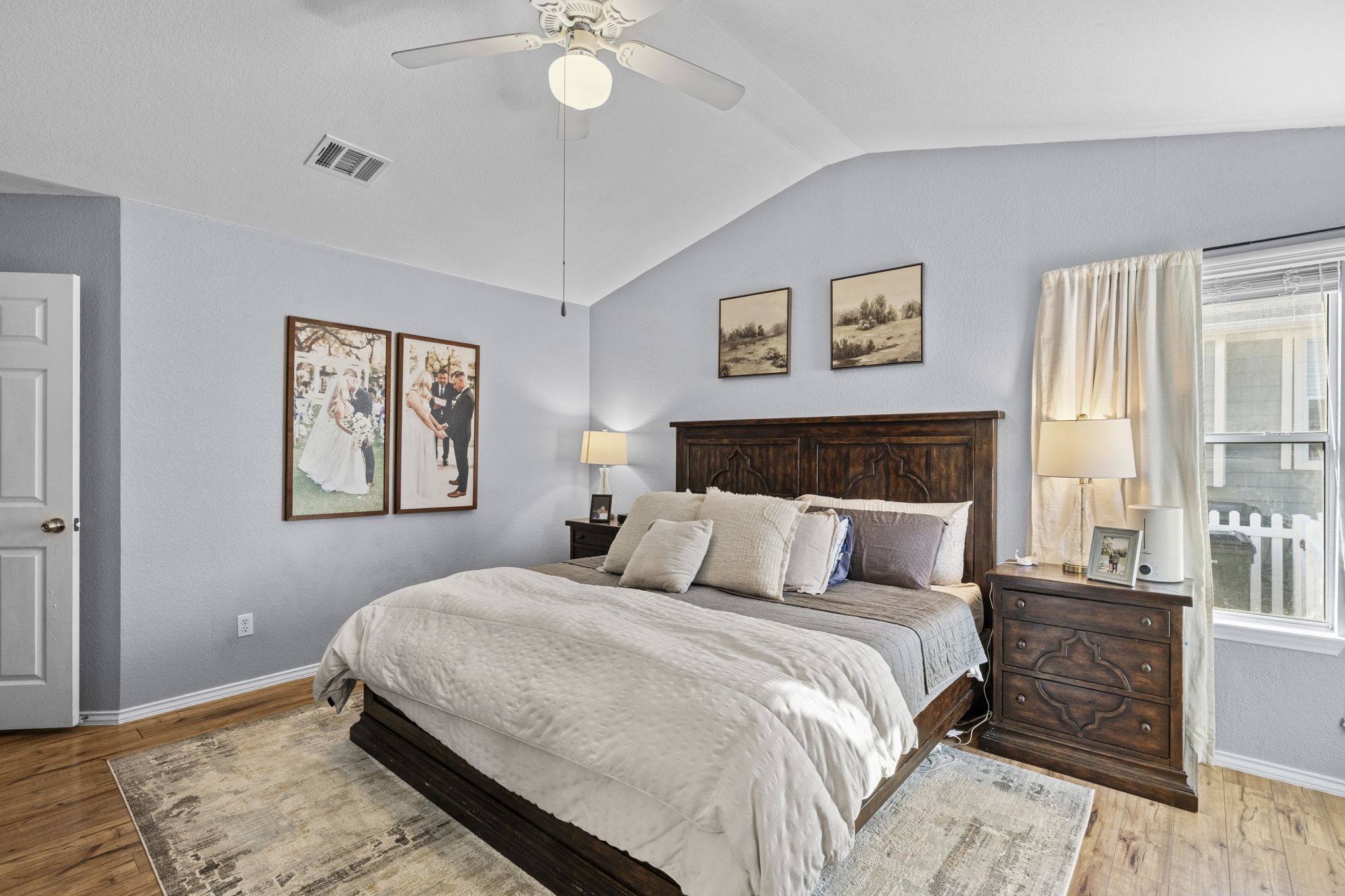 175 Wetzel Kyle, TX 78640 - Photo 11 of 40 Primary bedroom with vaulted ceiling and ceiling fan
