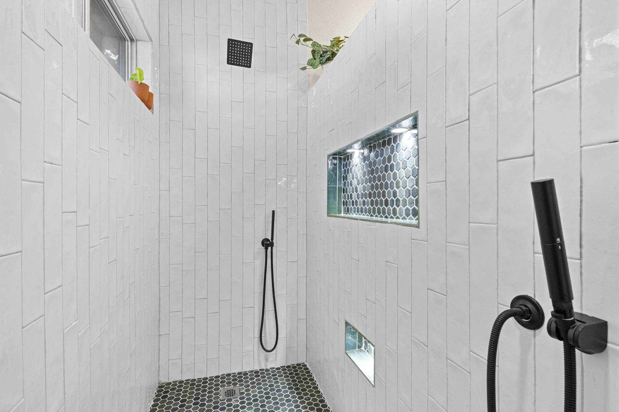 175 Wetzel Kyle, TX 78640 - Photo 15 of 40 Walk-in shower in primary bathroom with 3 head rain system.