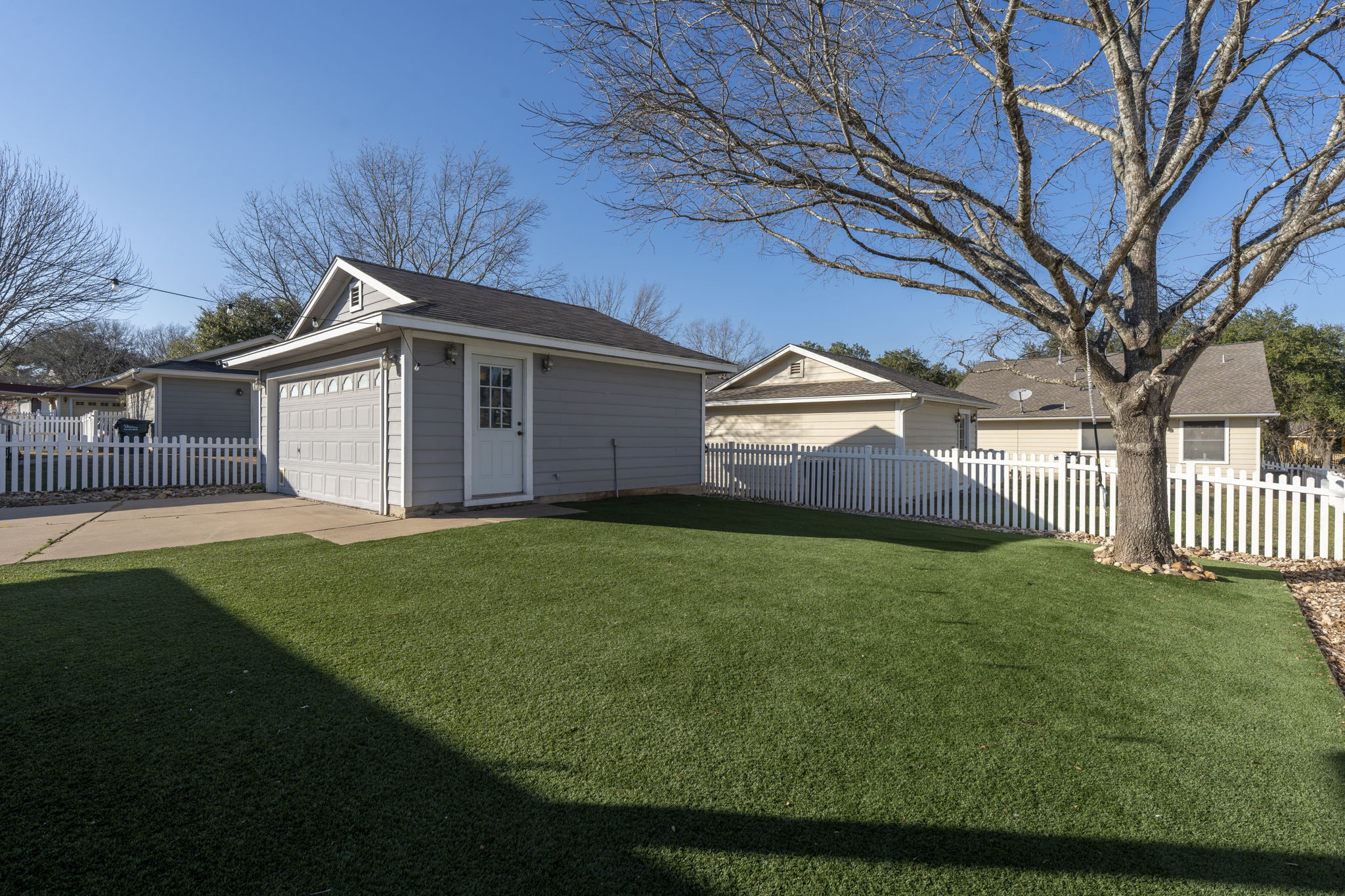 175 Wetzel Kyle, TX 78640 - Photo 28 of 40 Artificial turf in backyard with mature shade tree