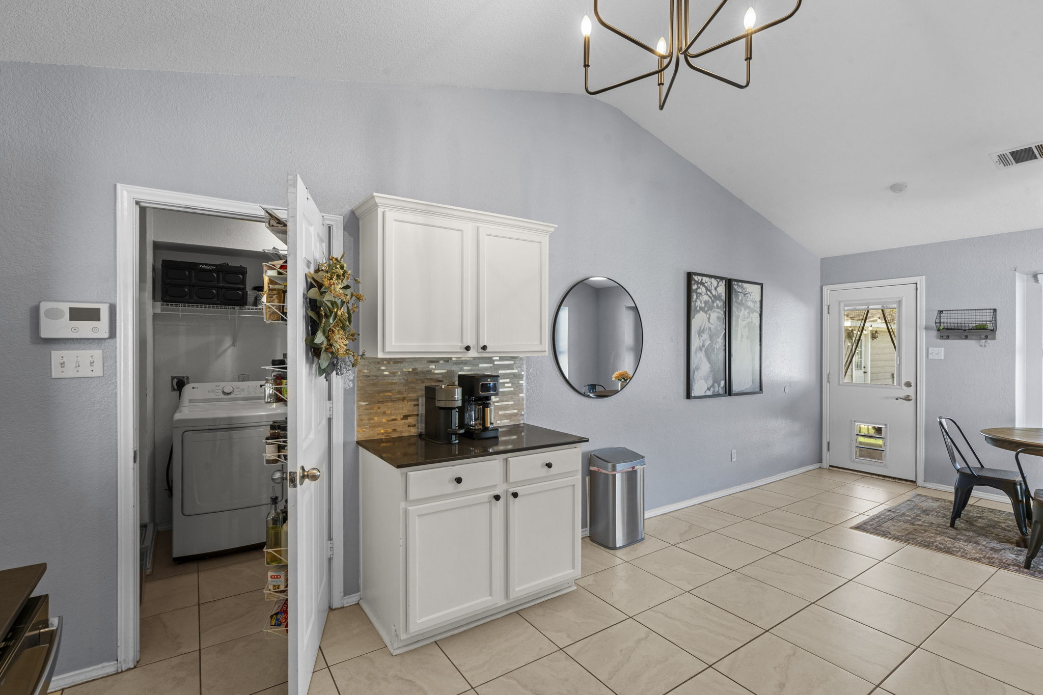 175 Wetzel Kyle, TX 78640 - Photo 9 of 40 Additional counter space and cabinets in the kitchen, with view of laundry room and pantry