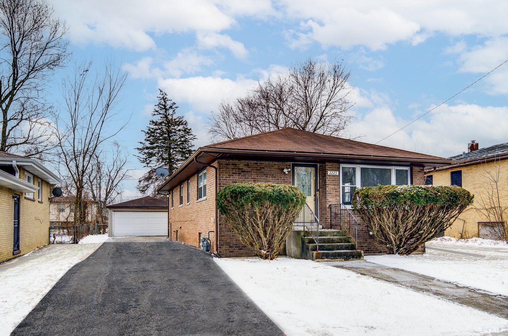 2223 West 156th Place Markham, IL 60426 - Photo 2 of 19 a front view of a house with garden