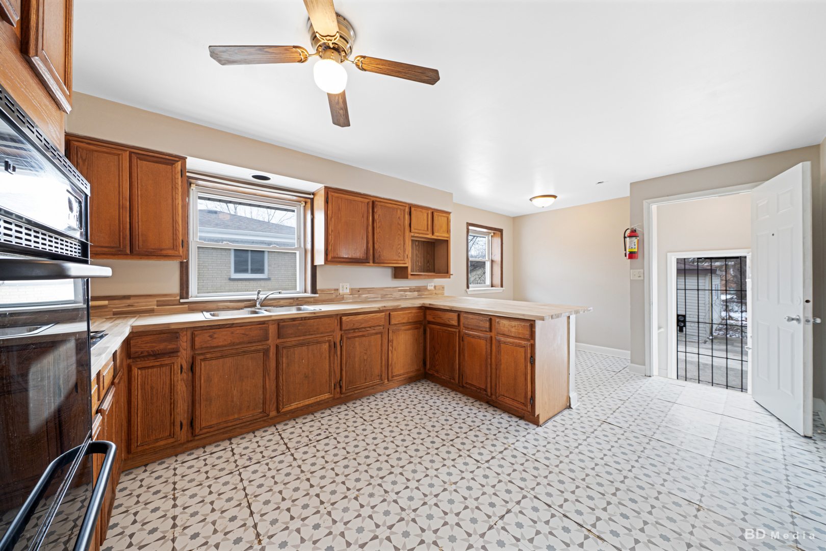 2223 West 156th Place Markham, IL 60426 - Photo 4 of 19 a kitchen with stainless steel appliances granite countertop a sink and cabinets