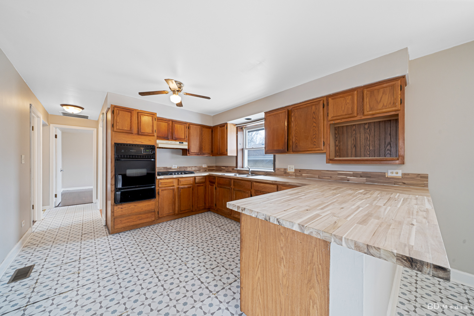 2223 West 156th Place Markham, IL 60426 - Photo 6 of 19 a large kitchen with a stove a sink dishwasher and a refrigerator