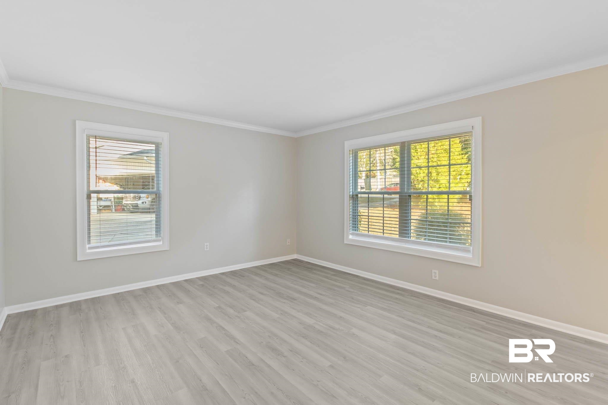 608 Southern Way Daphne, AL 36527 - Photo 4 of 35 Spare room with light wood-style floors and ornamental molding