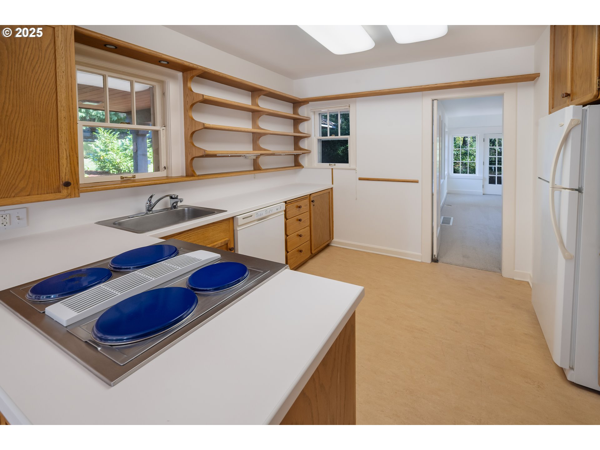 475 Leslie Street Southeast Salem, OR 97301 - Photo 20 of 47 a kitchen with stainless steel appliances granite countertop a sink a stove and a refrigerator