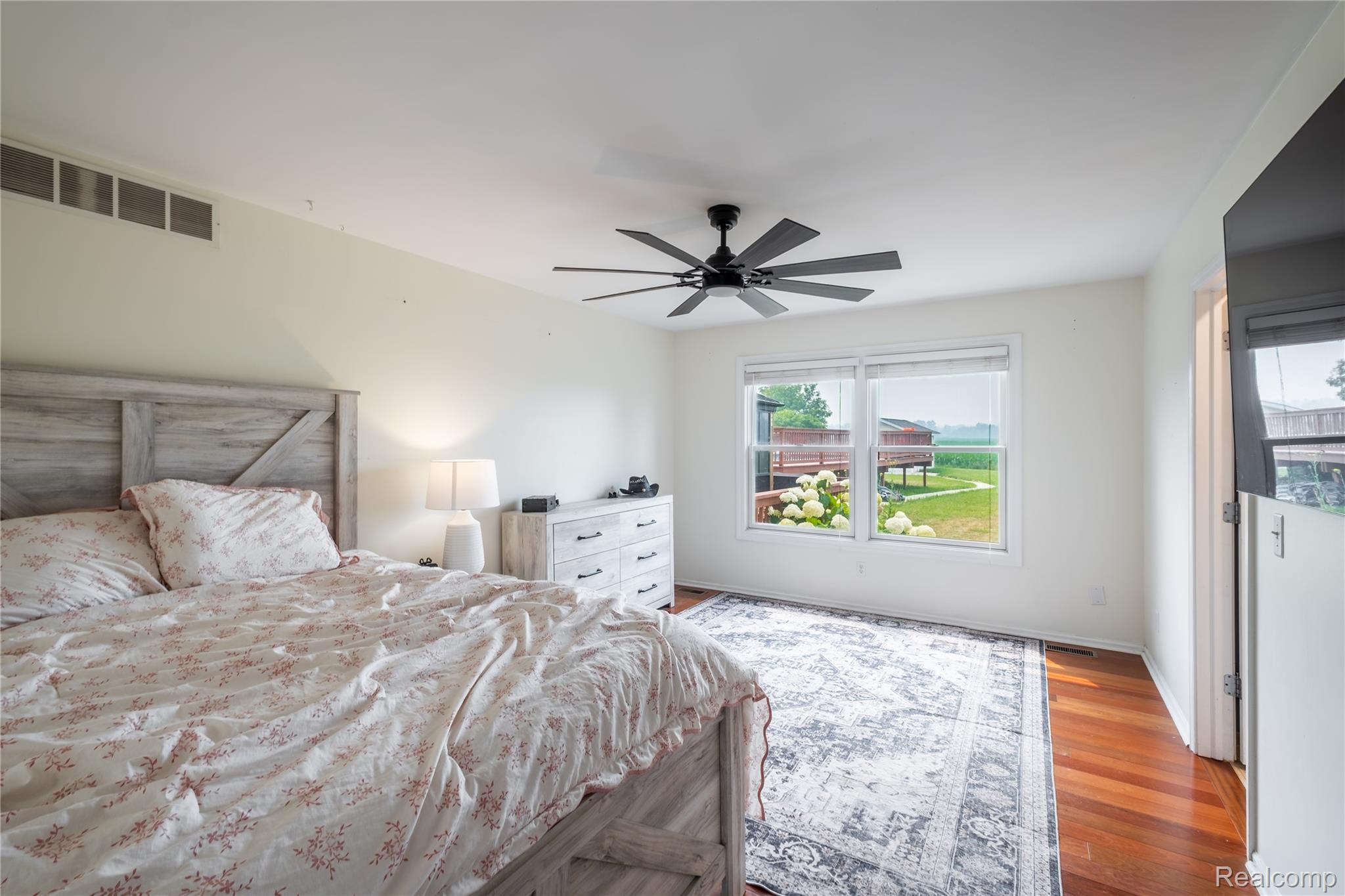 10250 Duffield Road Gaines, MI 48436 - Photo 28 of 28 Hardwood flooring, recessed lighting, and a modern ceiling fan