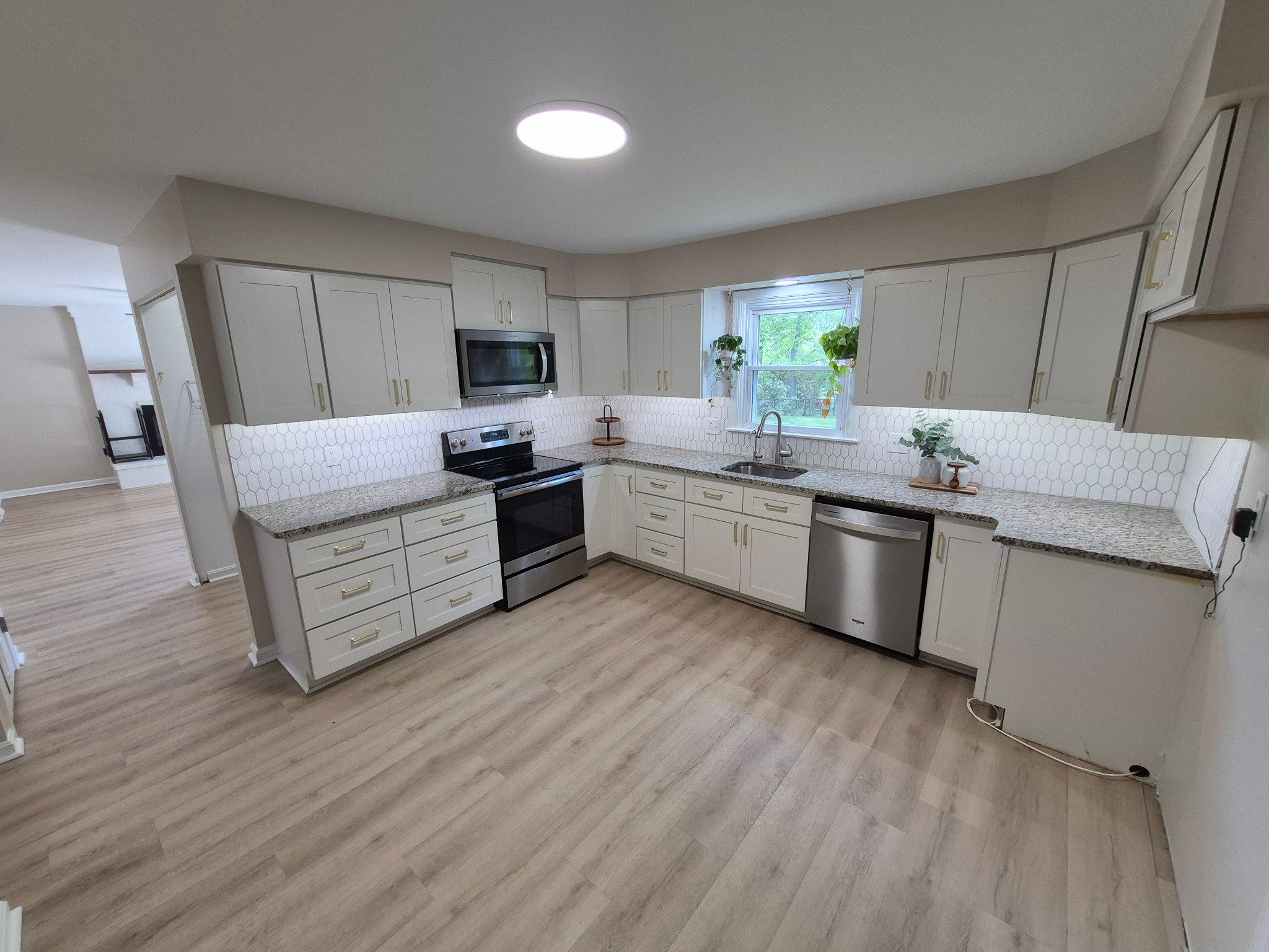 1406 Princeton Road Mechanicsburg, PA 17050 - Photo 16 of 53 a kitchen with stainless steel appliances granite countertop a stove a sink dishwasher and a refrigerator