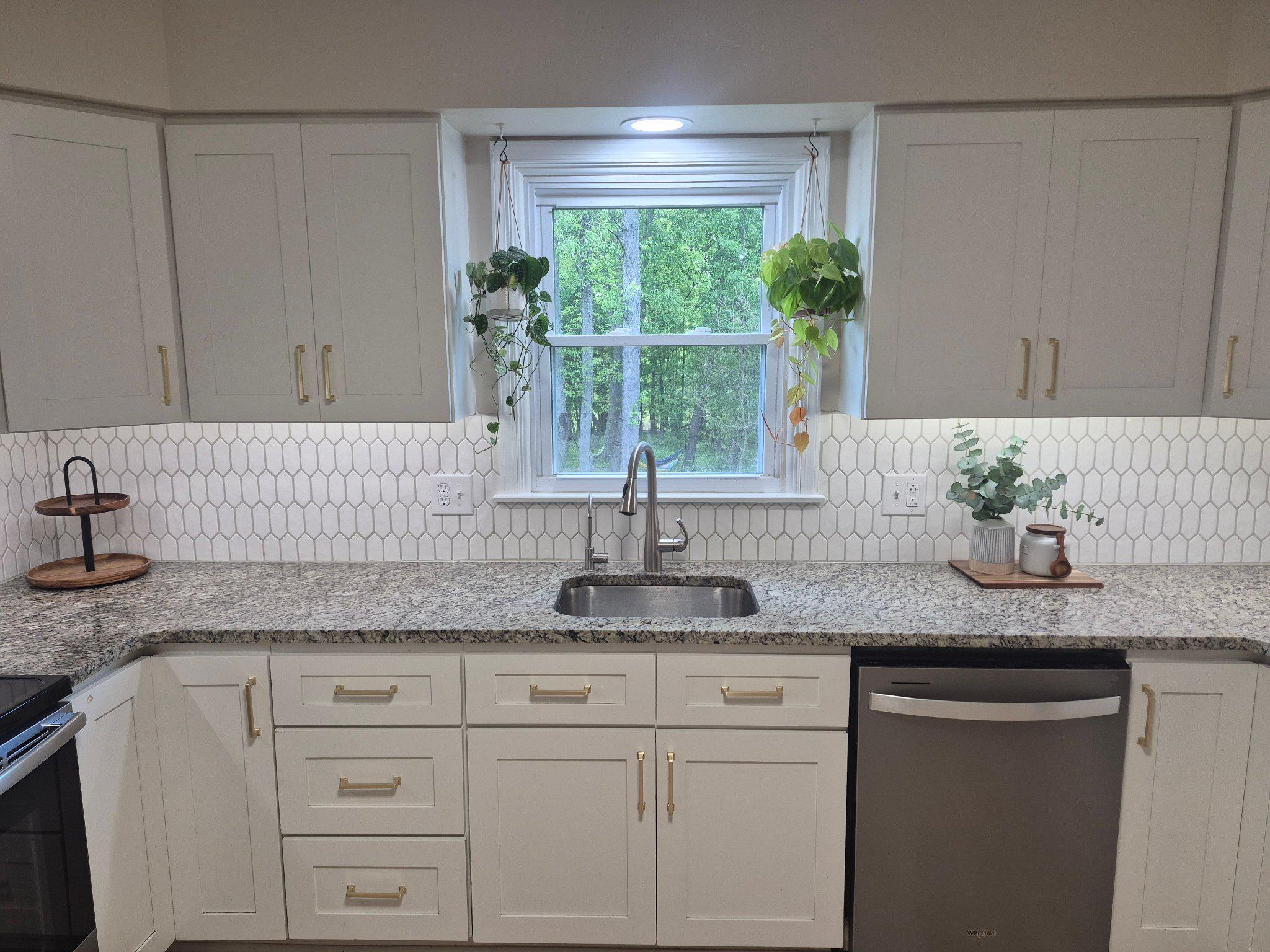 1406 Princeton Road Mechanicsburg, PA 17050 - Photo 19 of 53 a kitchen with granite countertop stainless steel appliances white cabinets and a large window