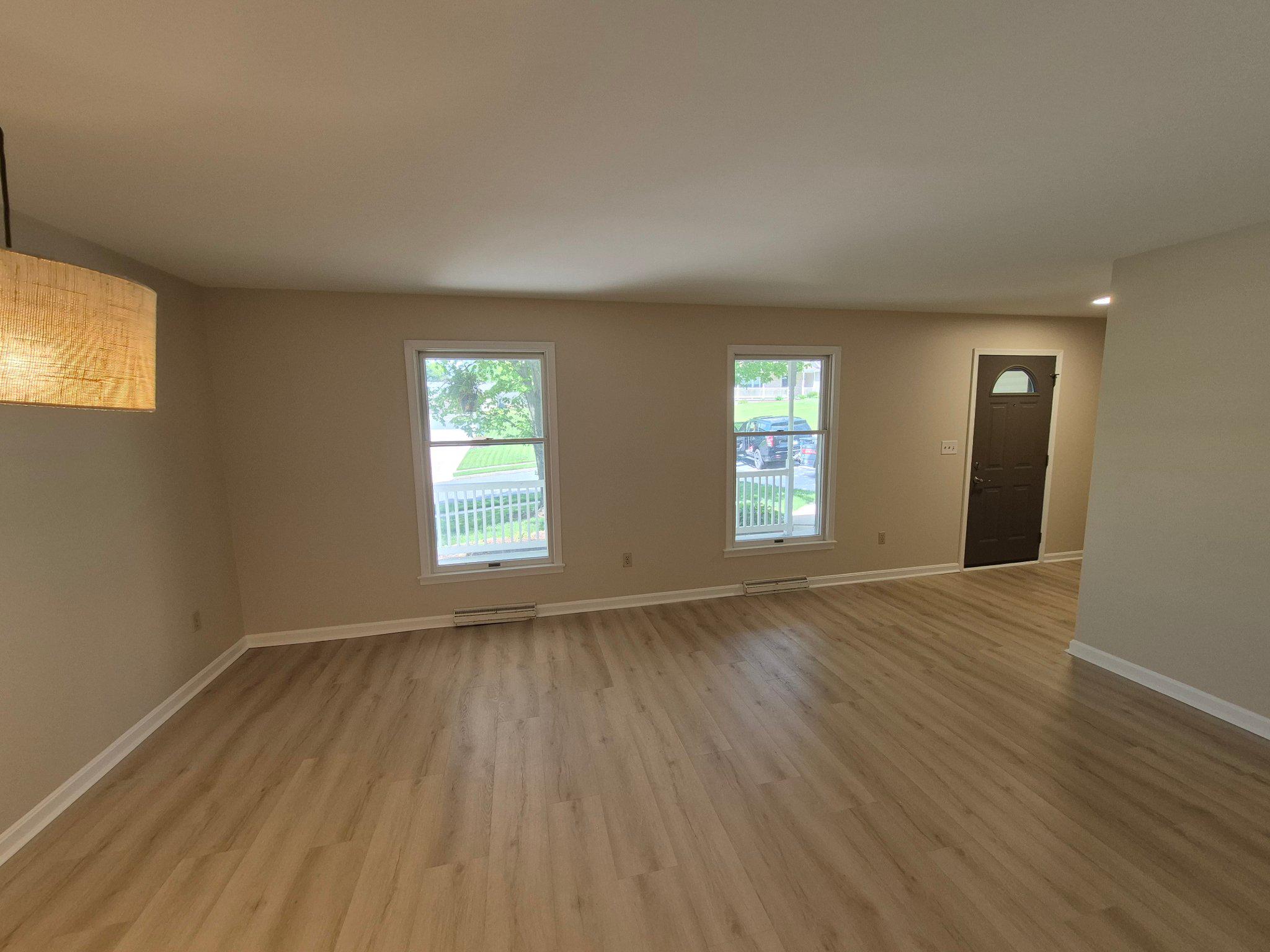 1406 Princeton Road Mechanicsburg, PA 17050 - Photo 24 of 53 a view of an empty room with wooden floor and a window
