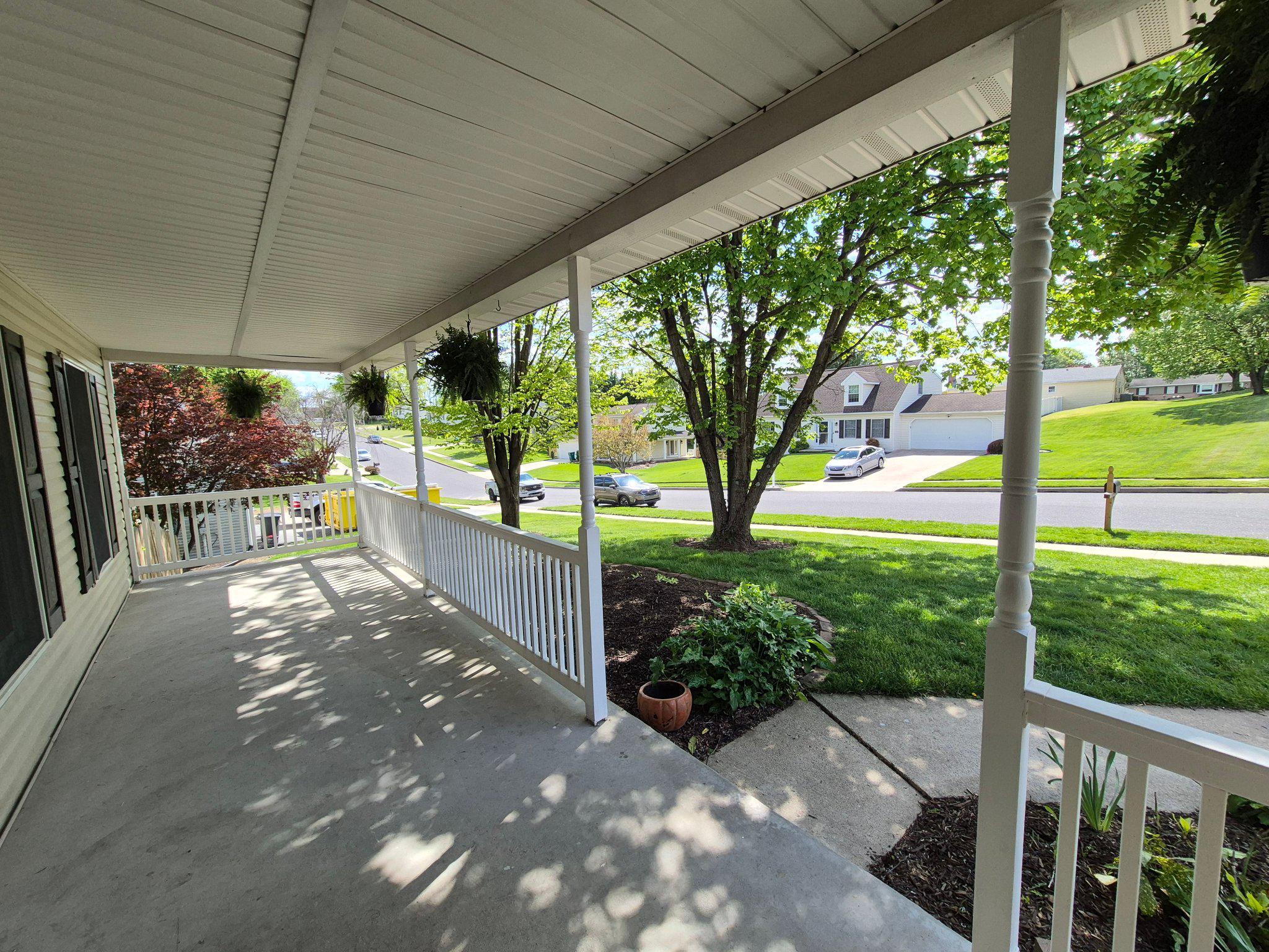 1406 Princeton Road Mechanicsburg, PA 17050 - Photo 3 of 53 a view of a porch with chairs and backyard