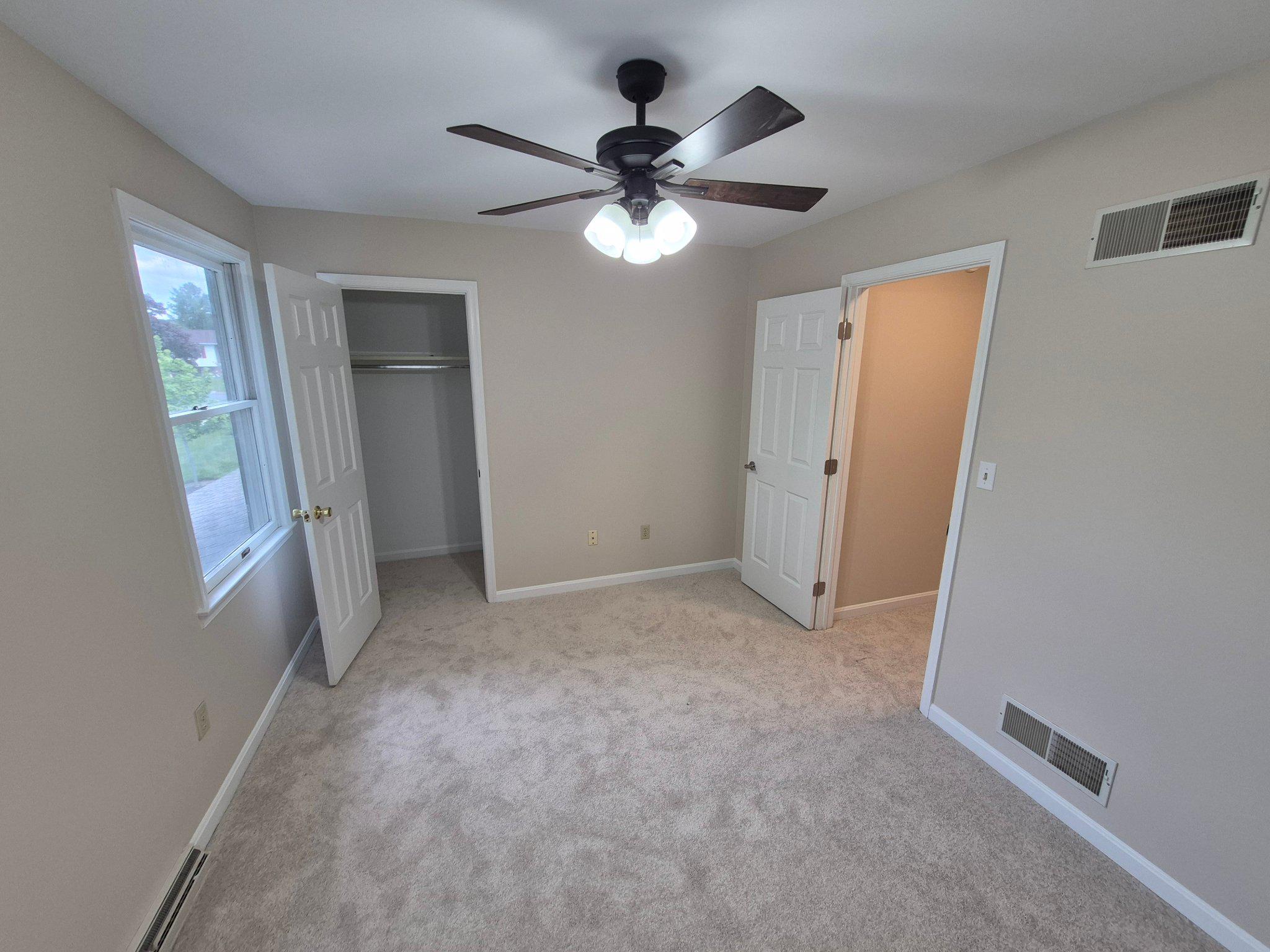 1406 Princeton Road Mechanicsburg, PA 17050 - Photo 31 of 53 a view of a livingroom with a ceiling fan and window