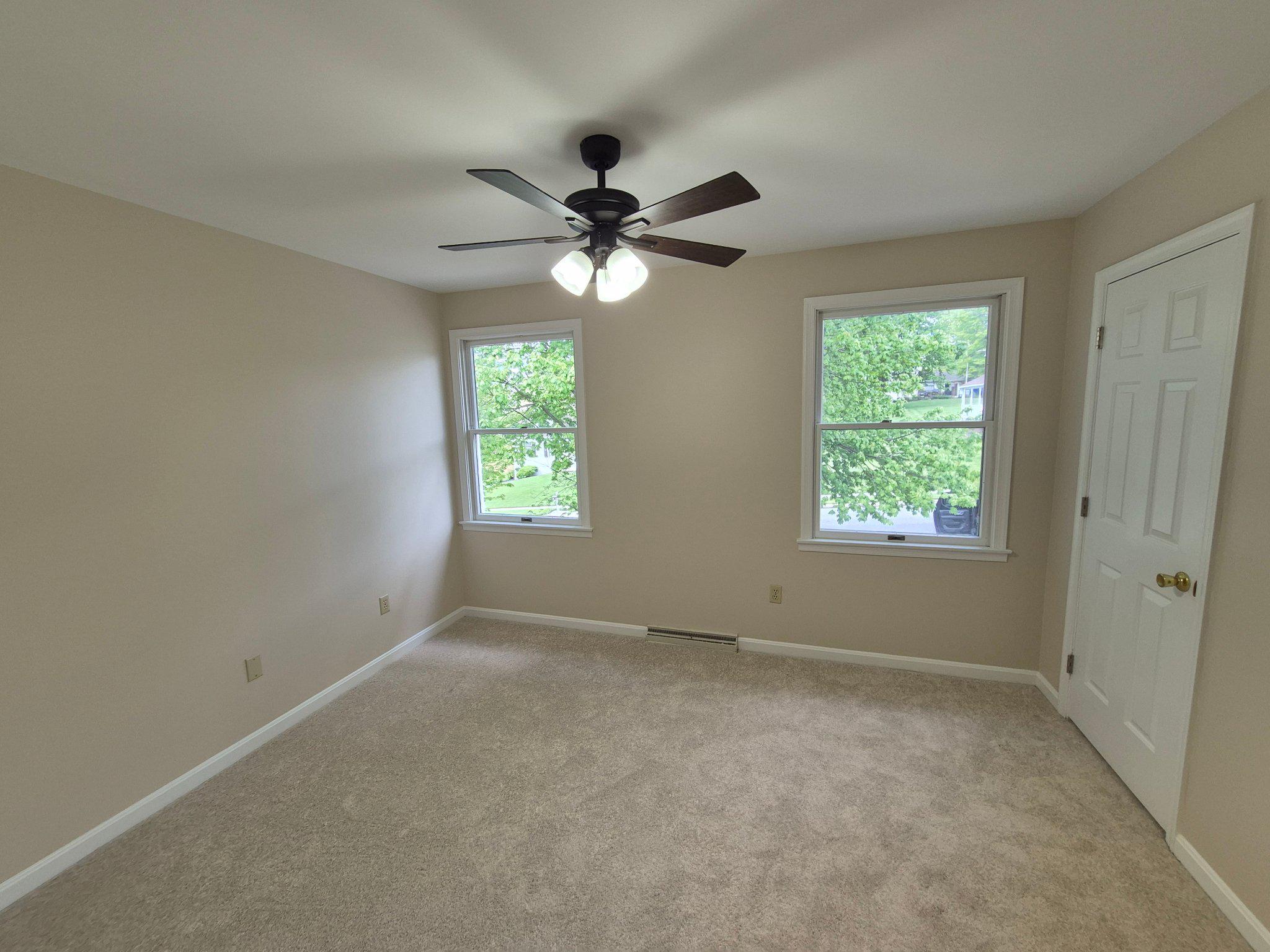 1406 Princeton Road Mechanicsburg, PA 17050 - Photo 32 of 53 an empty room with windows and fan
